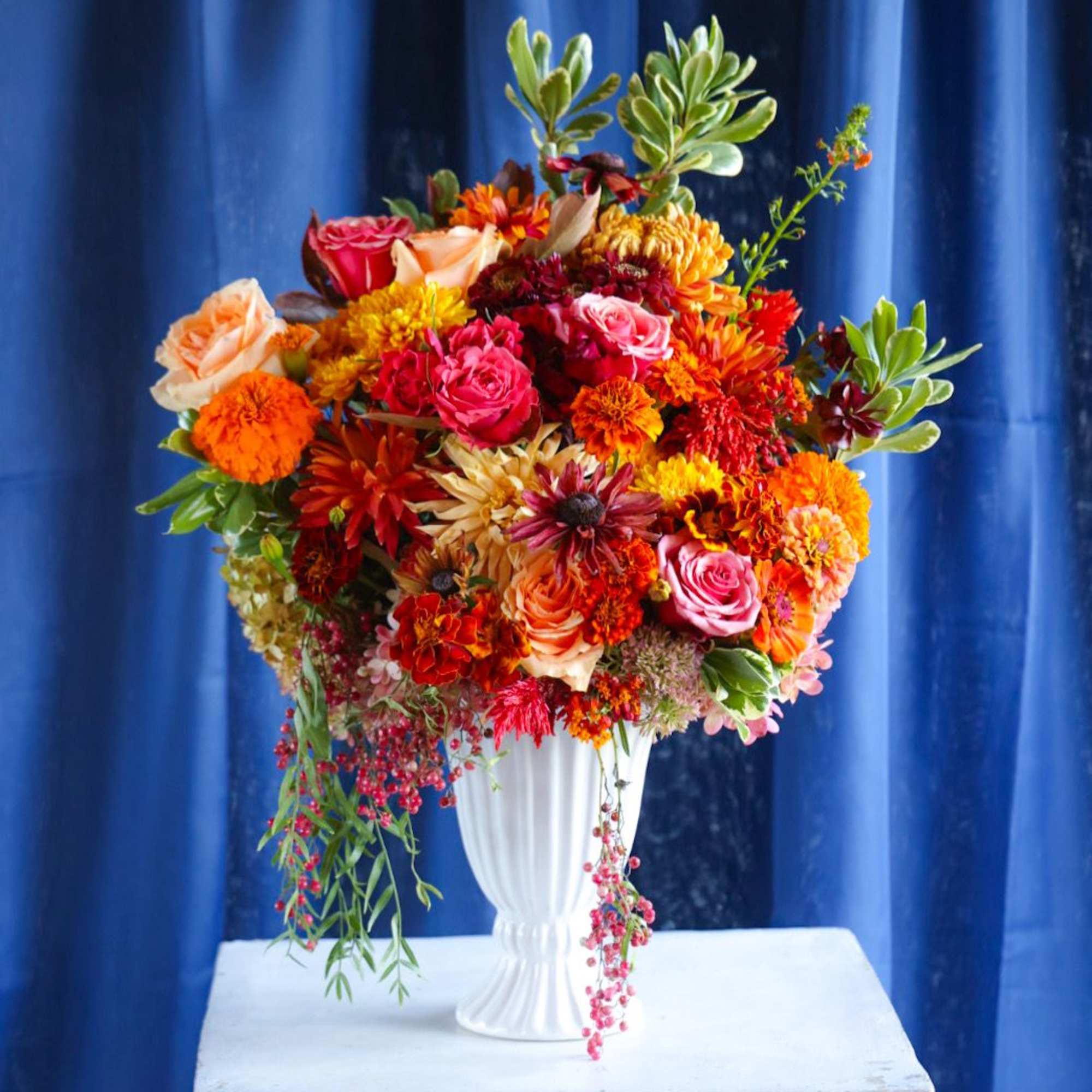 The Russet Leaves Arrangement is the quitessential classic autumn arrangement. Bursting with
