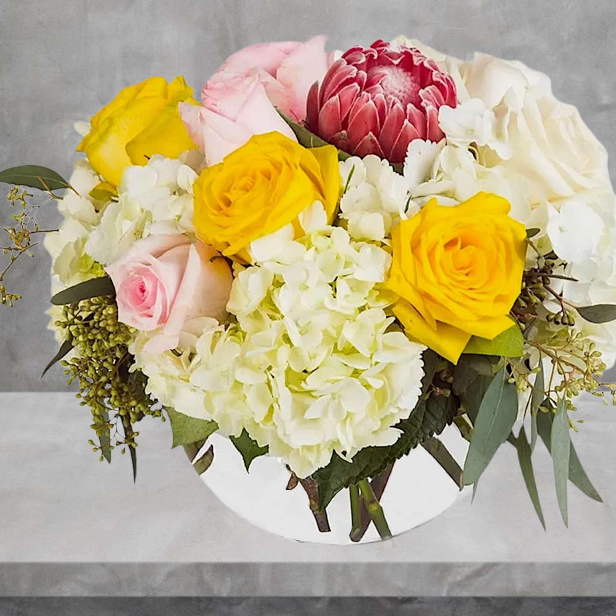 The Pink Ice Protea create brings a hint of the tropics to