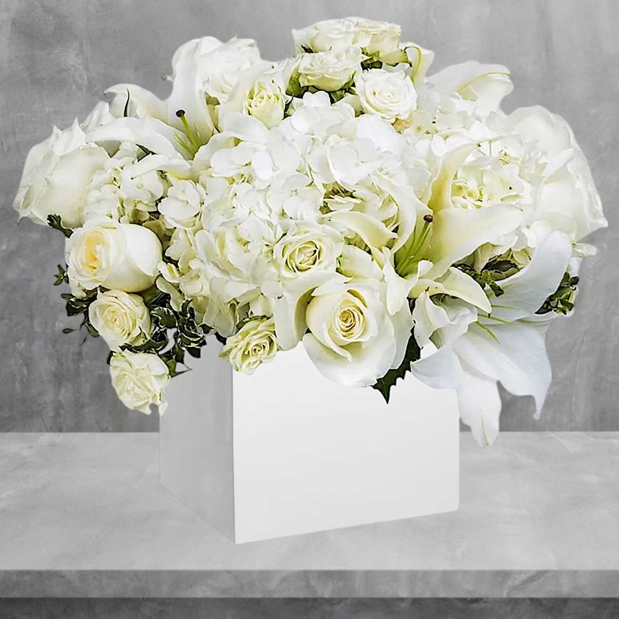 What a beautiful white flower arrangement. Great for any occasion.

DETAILS
Beautiful white roses