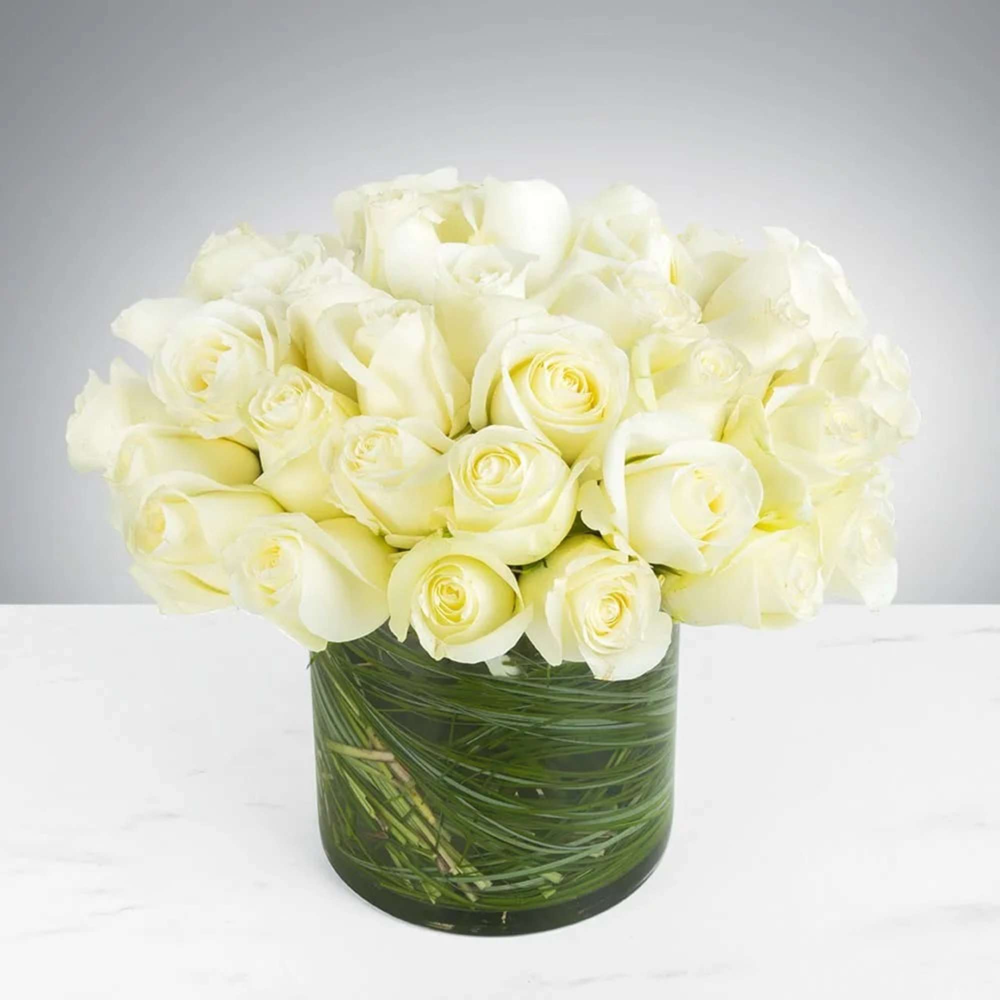 Make a bold statement with this elegantly simple design. White roses symbolize