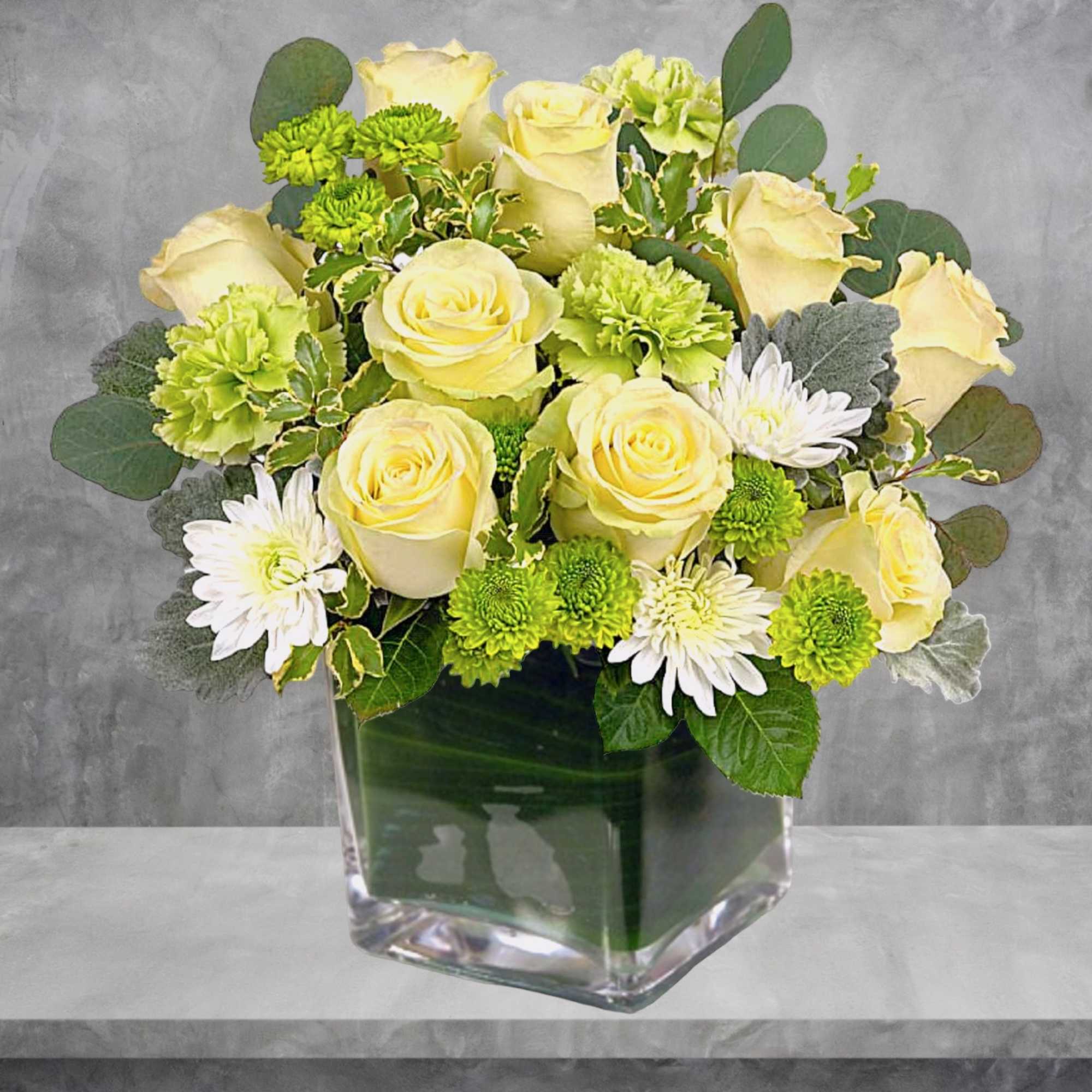 Bring beauty and peace to any occasion with this serenely elegant arrangement