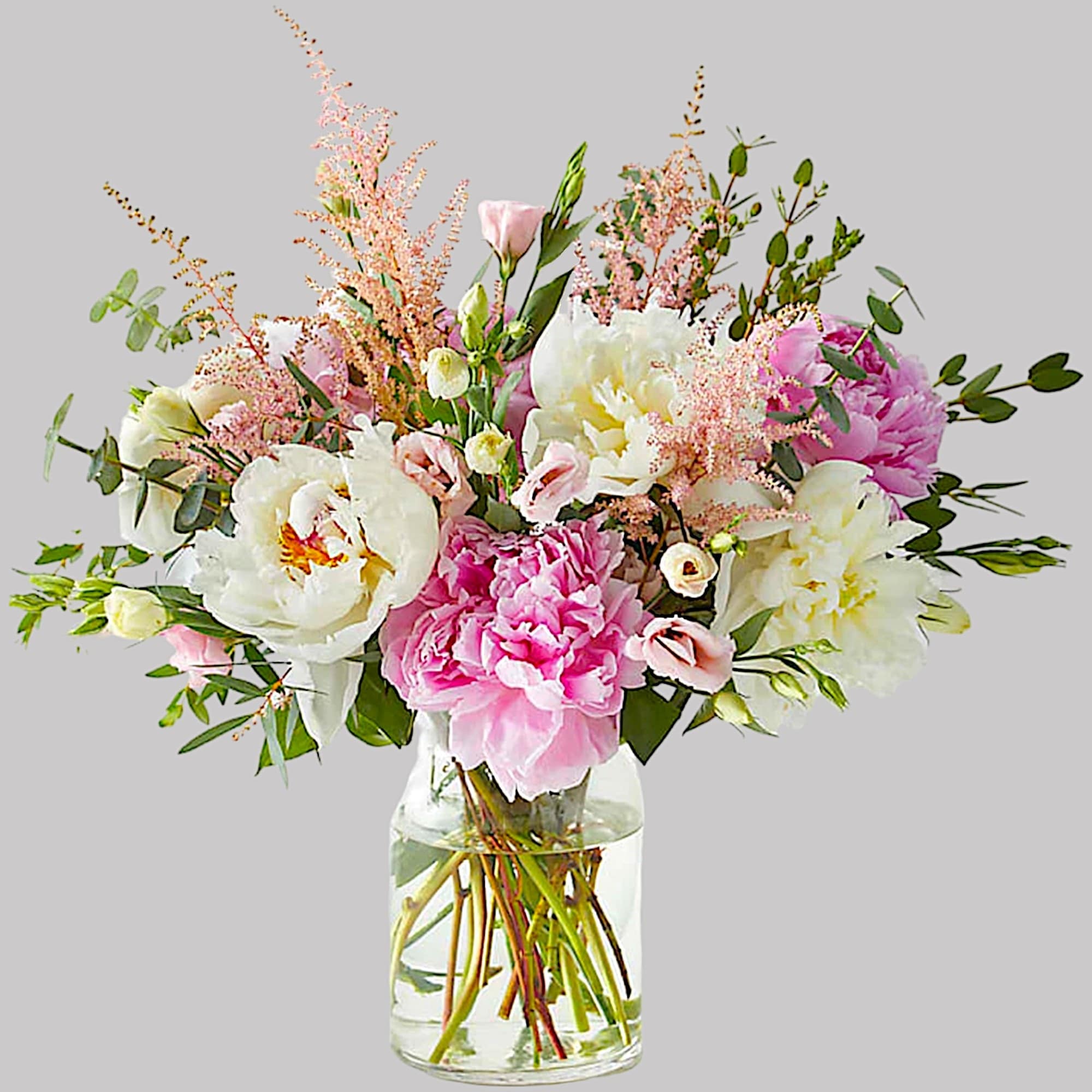 Bursting with bright pink and white peonies, this delightful mix is sure