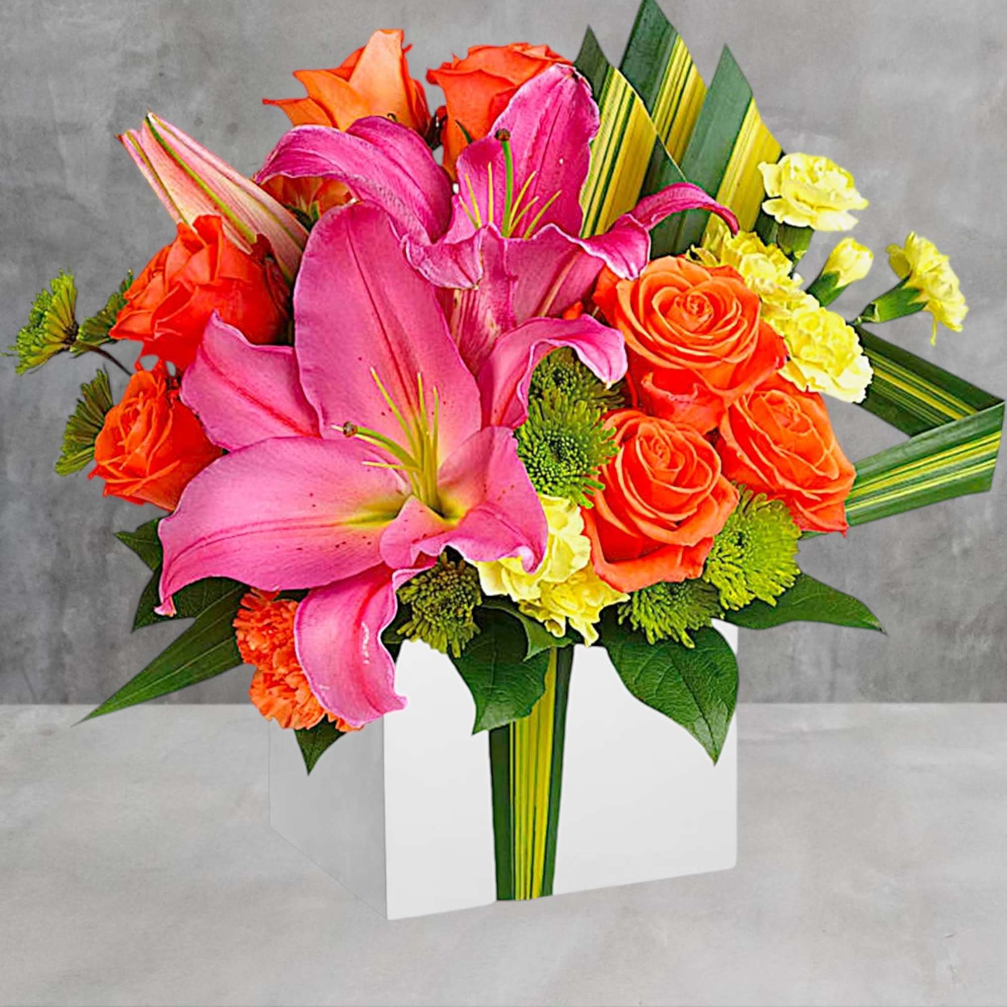 Color them happy when this cute cube arrives! Glorious pink lilies and