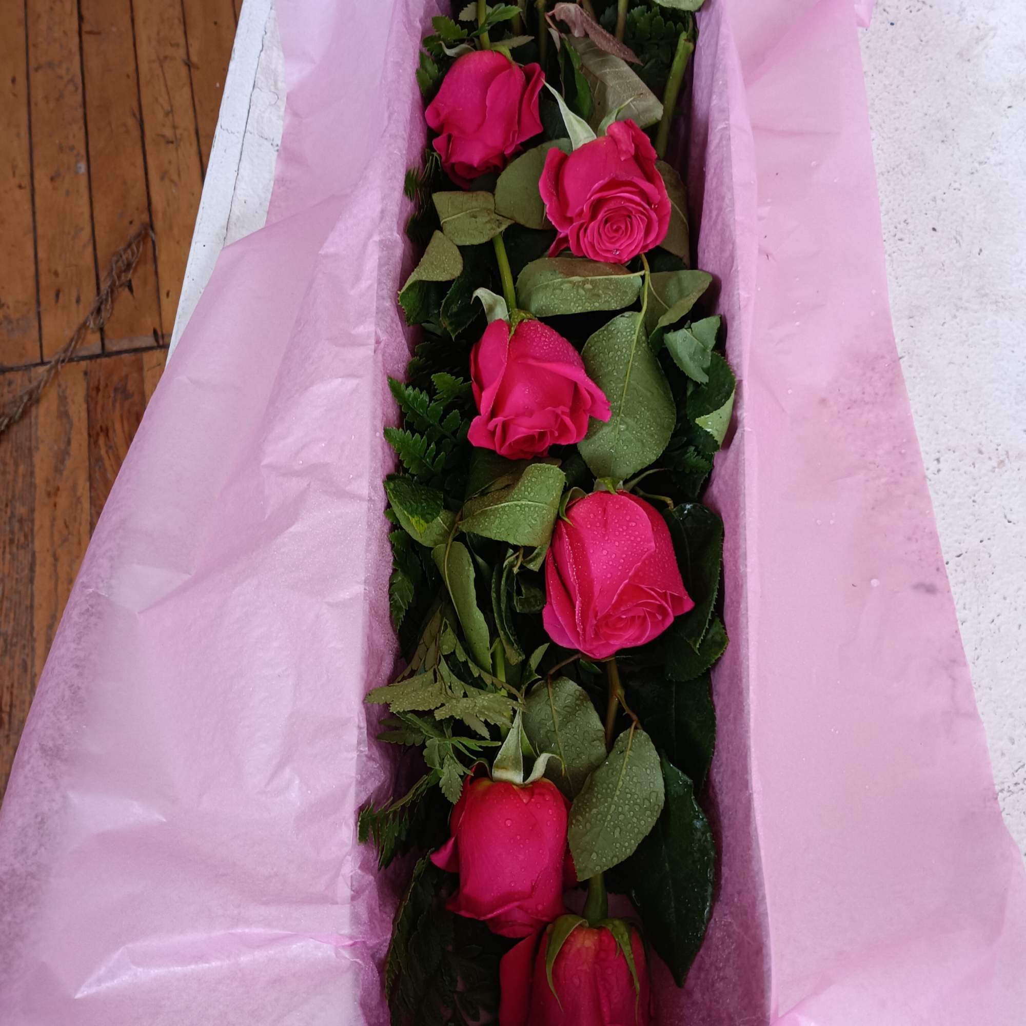 6 or 12 Pink Floyd roses boxed with greens and a bow.