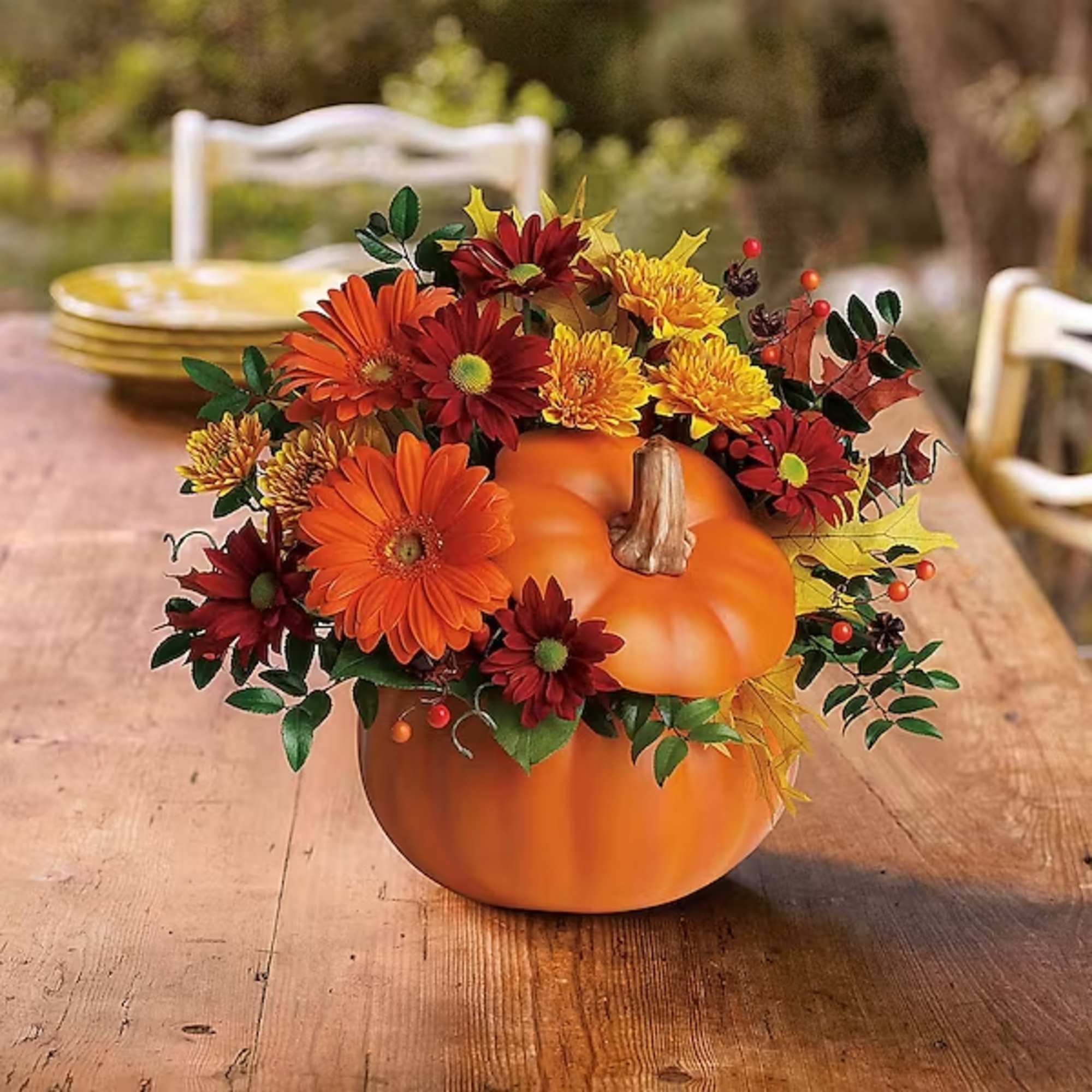 Perfect for a fall centerpiece, birthday or Halloween party, this flower-filled ceramic
