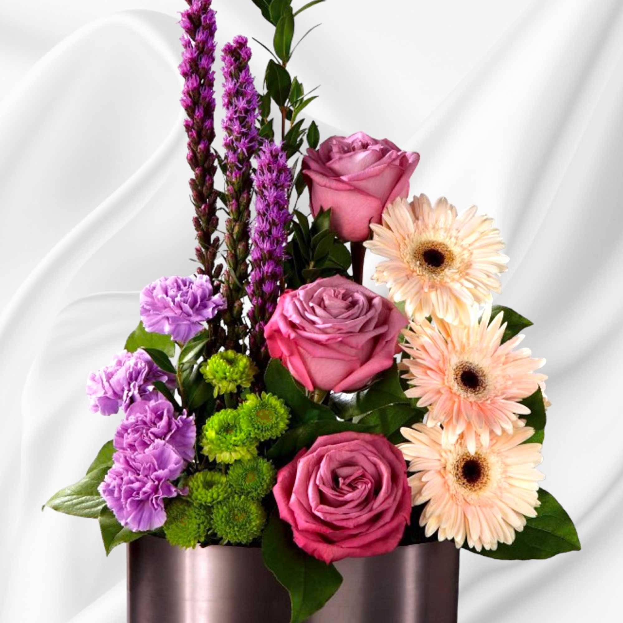 Sophisticated and refined, this stunning, artistic flower arrangement has a modern appeal