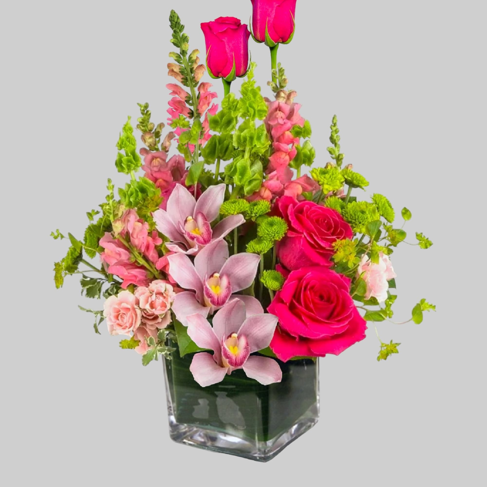 Escape to paradise with this lush and vibrant flower arrangement.  This
