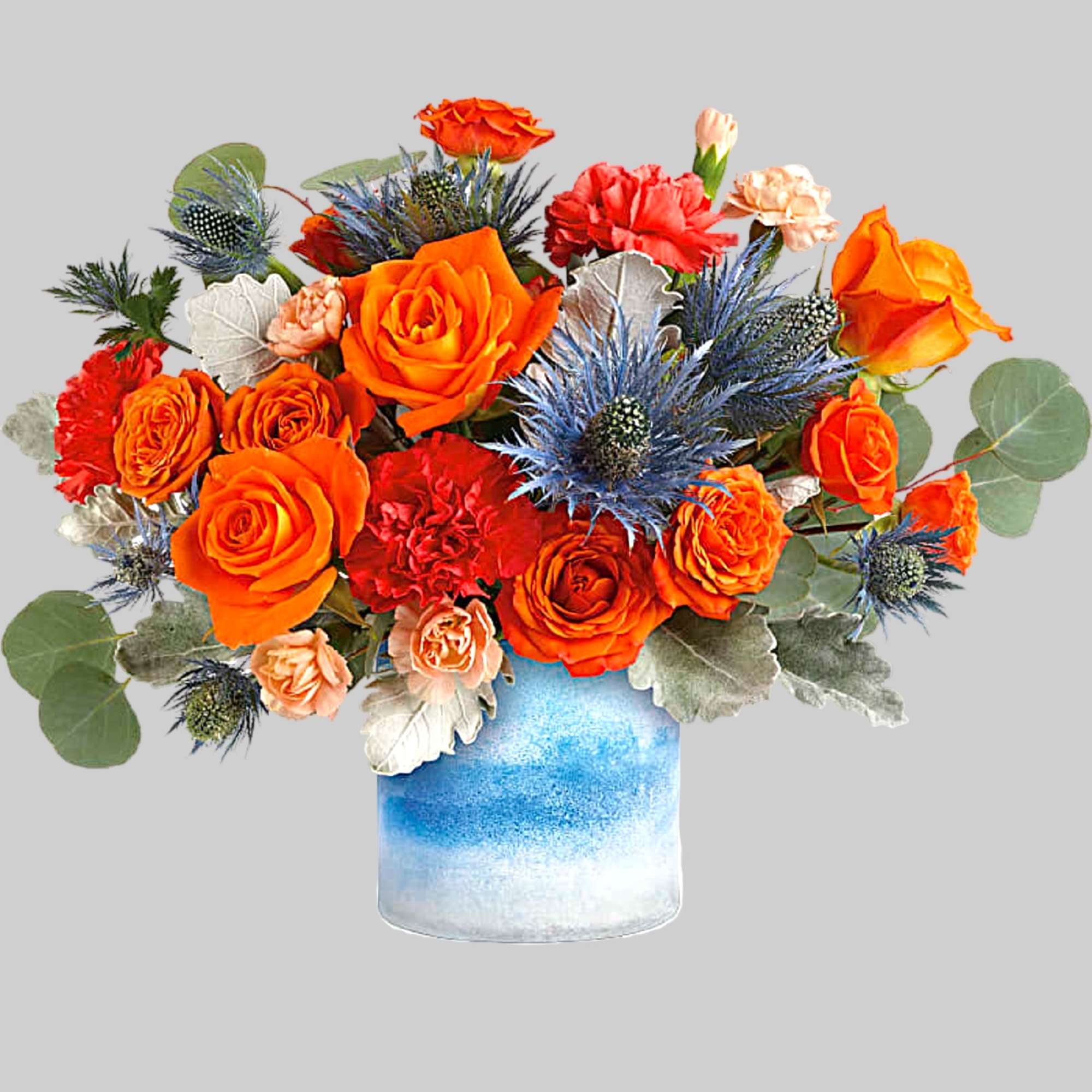 One of a kind! This standout mix of bold orange roses and