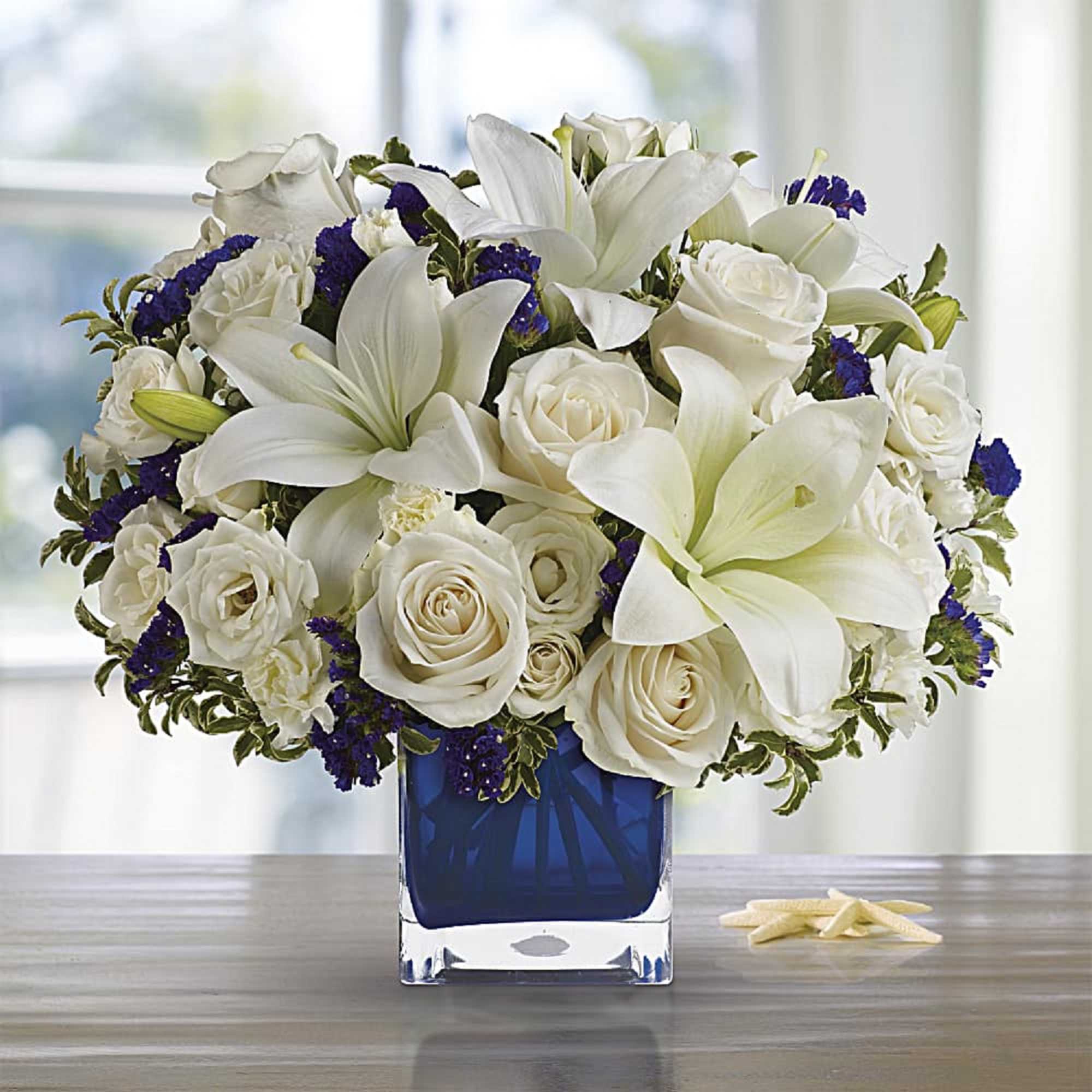 Like gazing into a clear blue sky, this serene arrangement soothes the