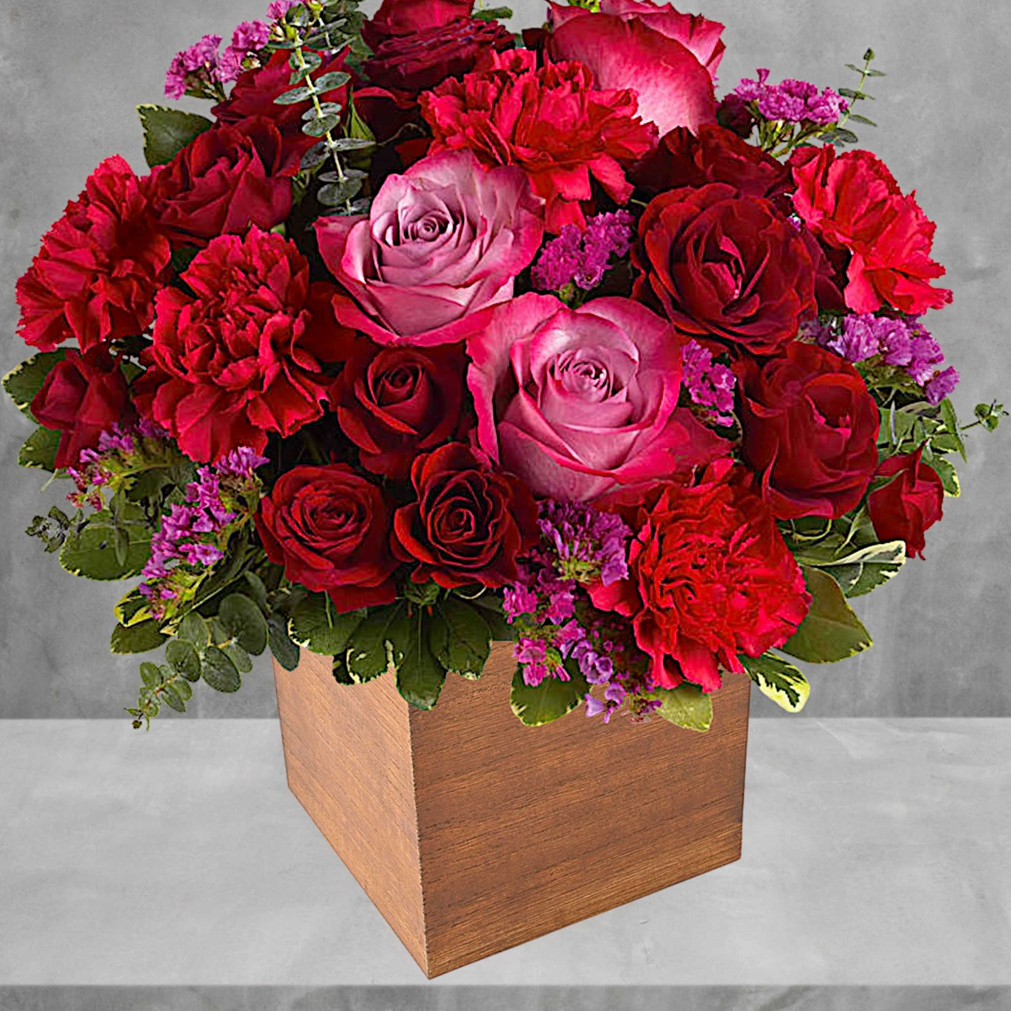 Pure passion. Bedazzle your beloved with luscious red and lavender roses in