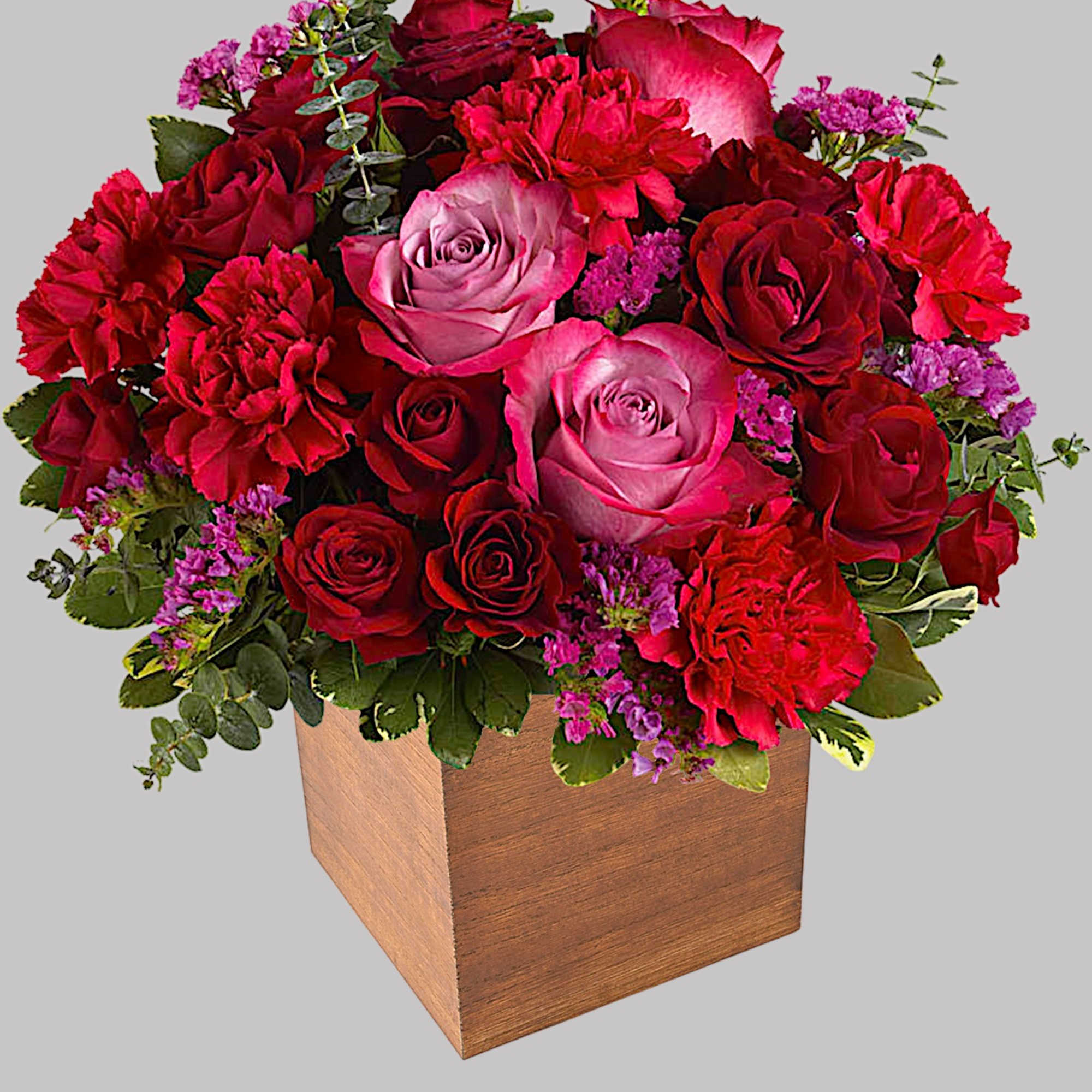 Pure passion. Bedazzle your beloved with luscious red and lavender roses in