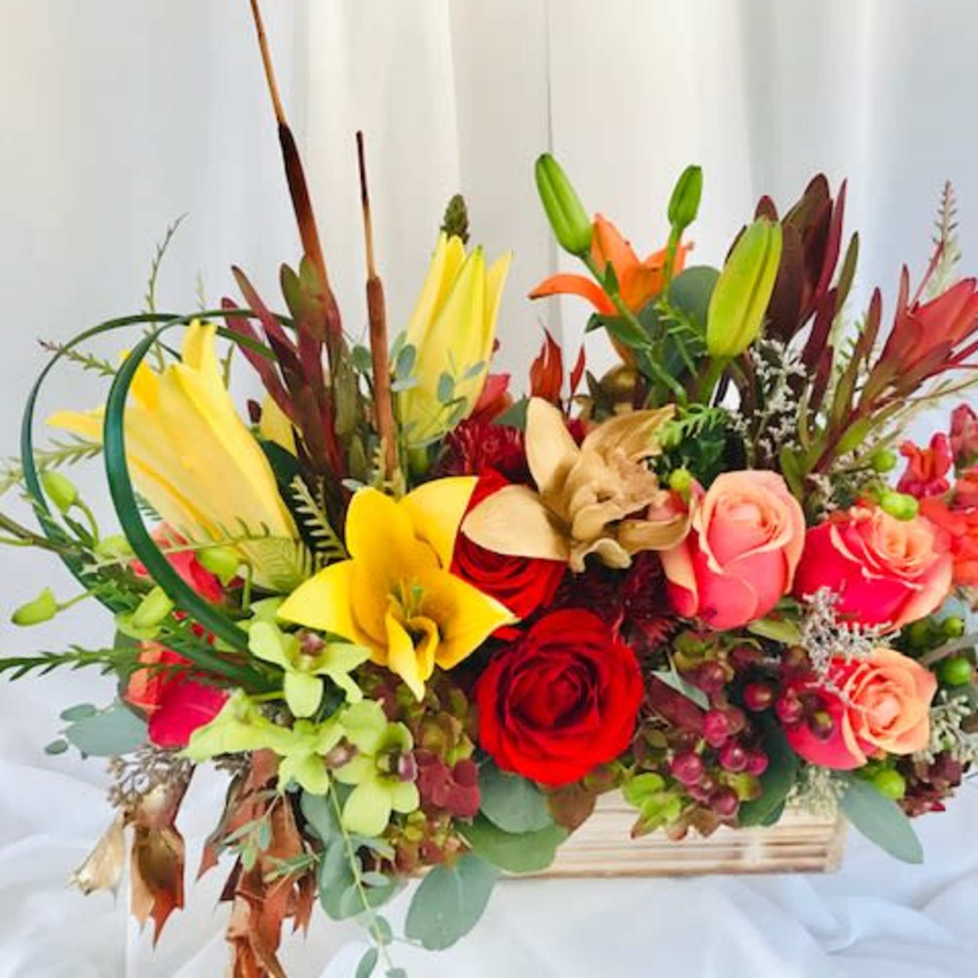 This beautiful assortment of flowers is perfect for the holidays. Give your