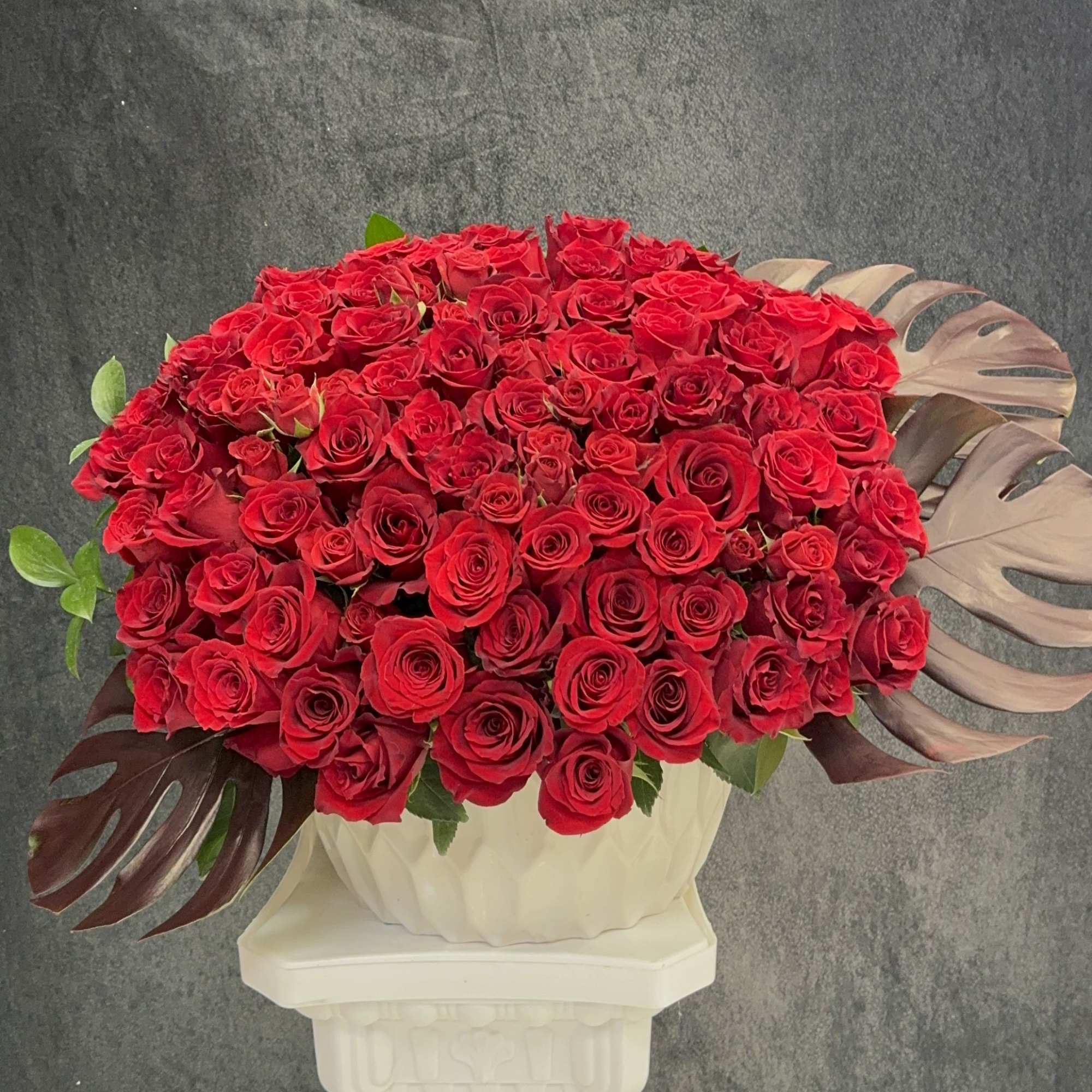 Beautiful and huge arrangement with lot of red roses