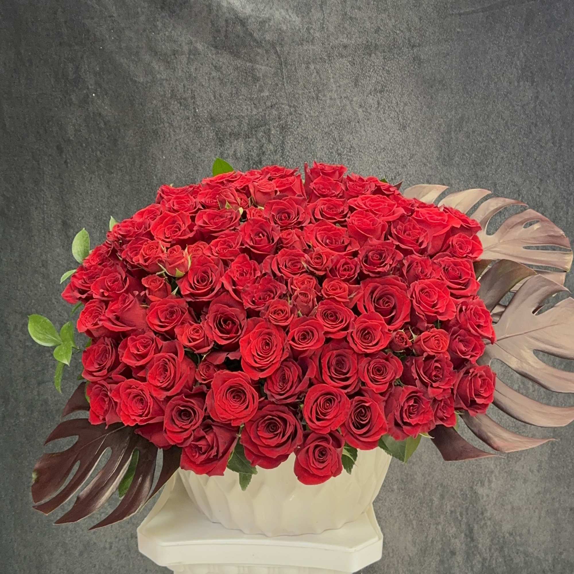 Beautiful and huge arrangement with lot of red roses
