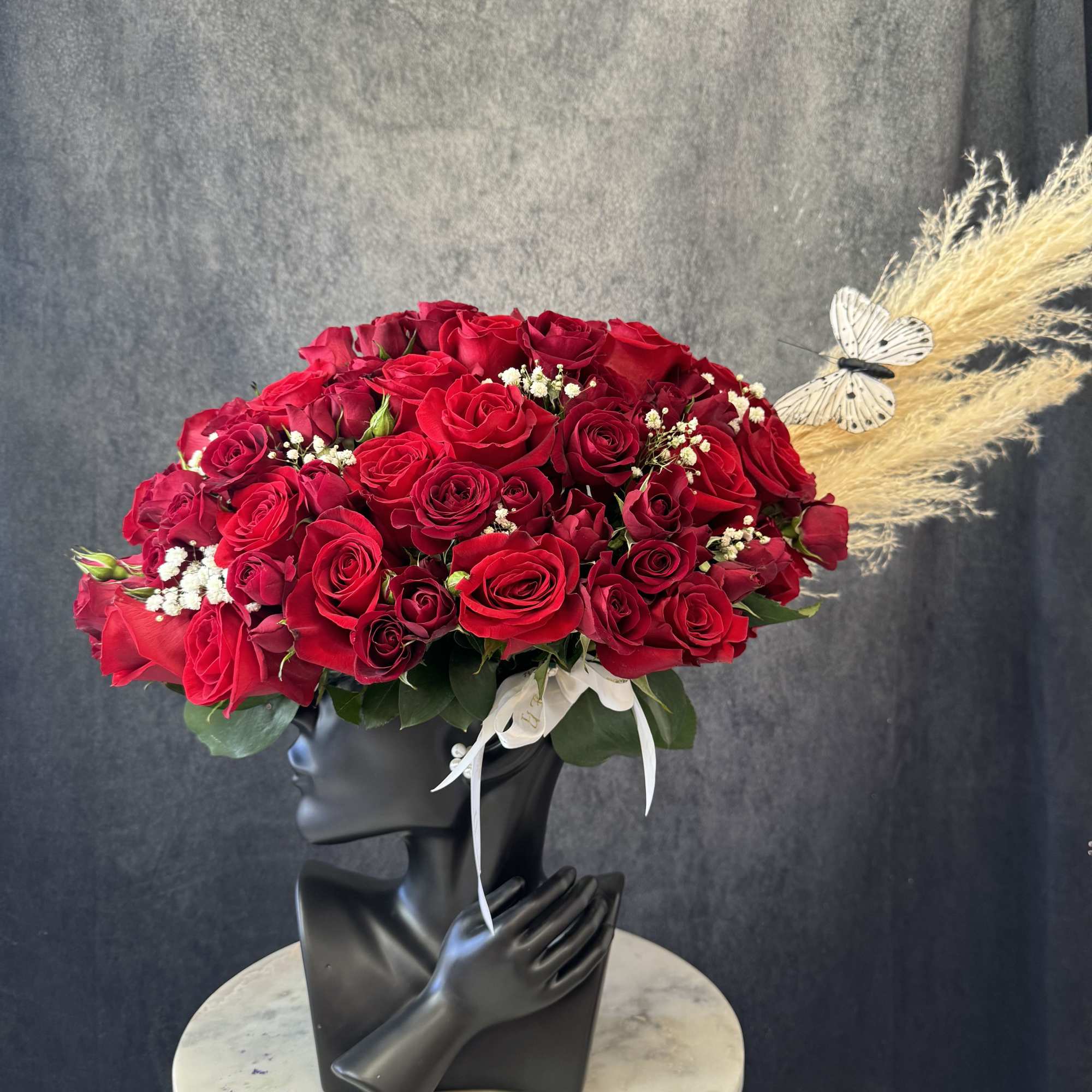 Gorgeous arrangement with glamour vase and red roses