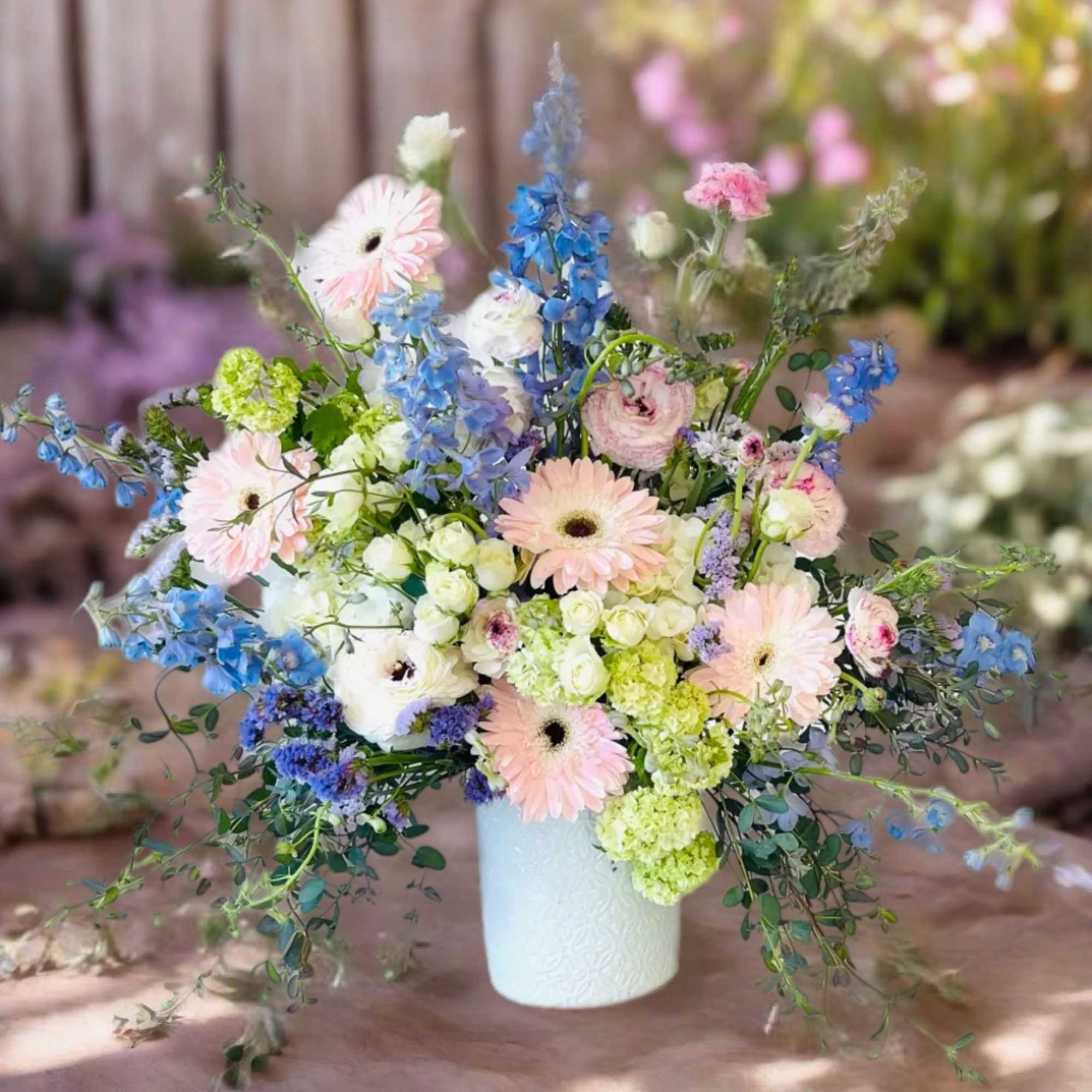 Indulge in the timeless elegance of our exquisite floral arrangement, where the