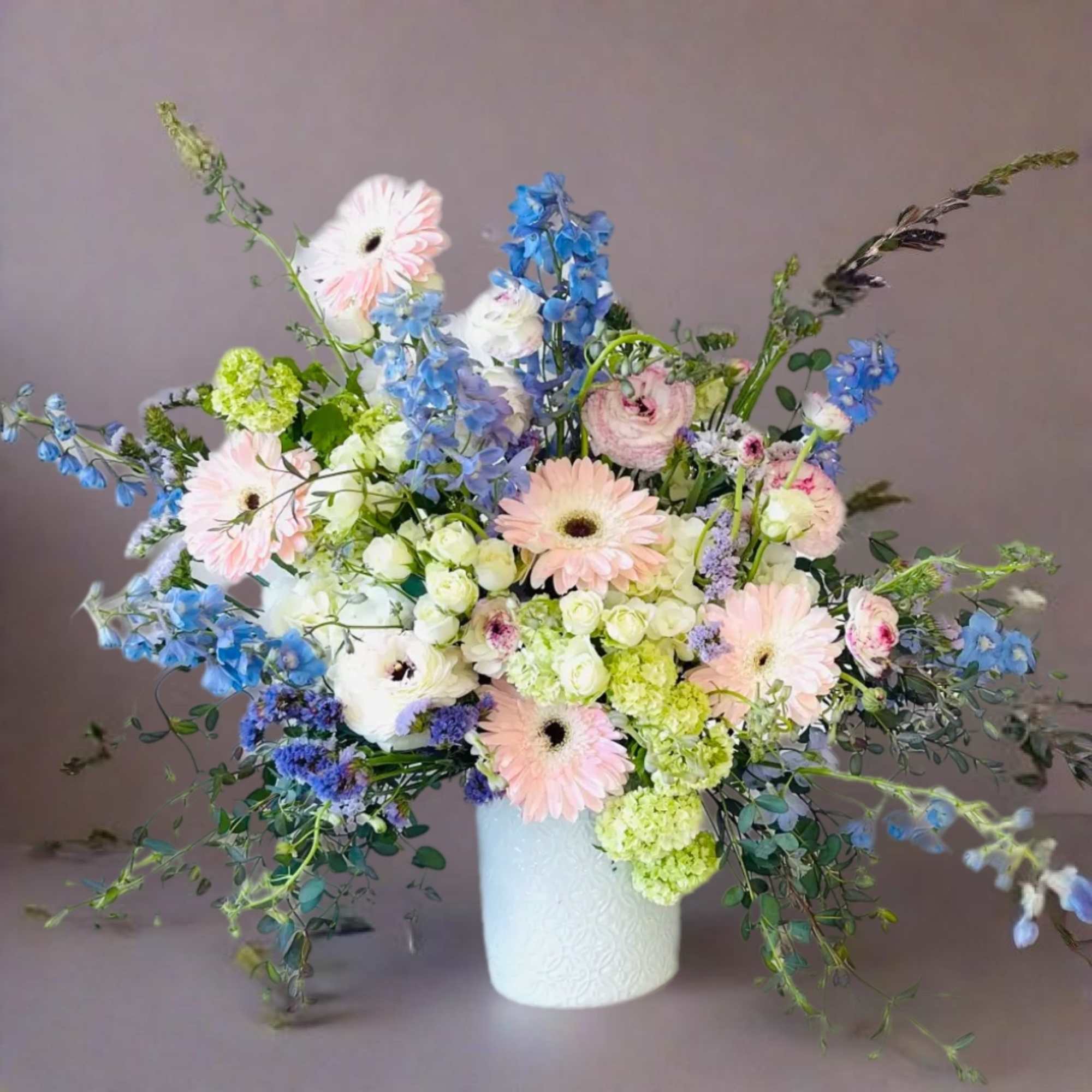 Indulge in the timeless elegance of our exquisite floral arrangement, where the