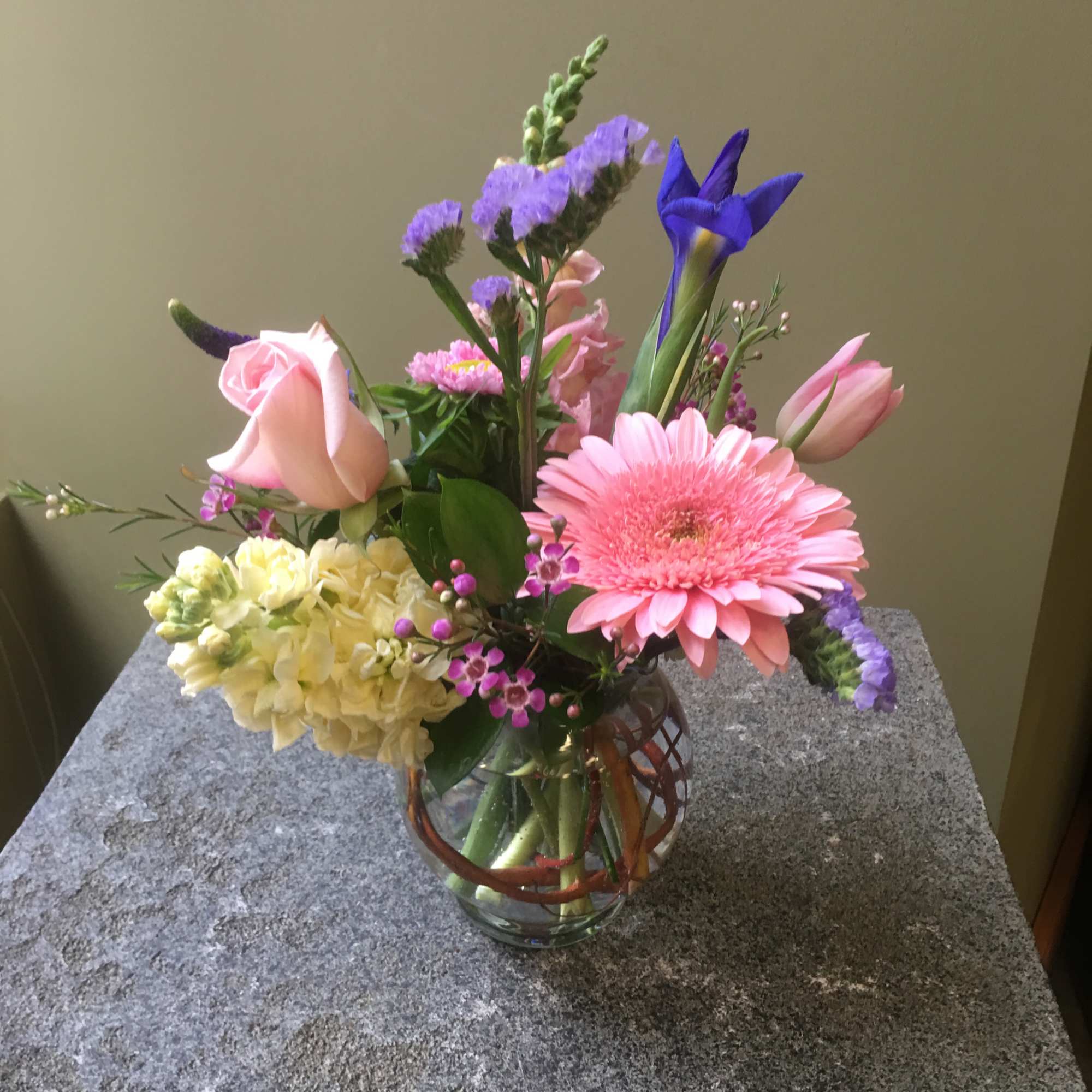 Designers choice arrangement of seasonal pastel flowers. Flowers will vary by what&#039;s