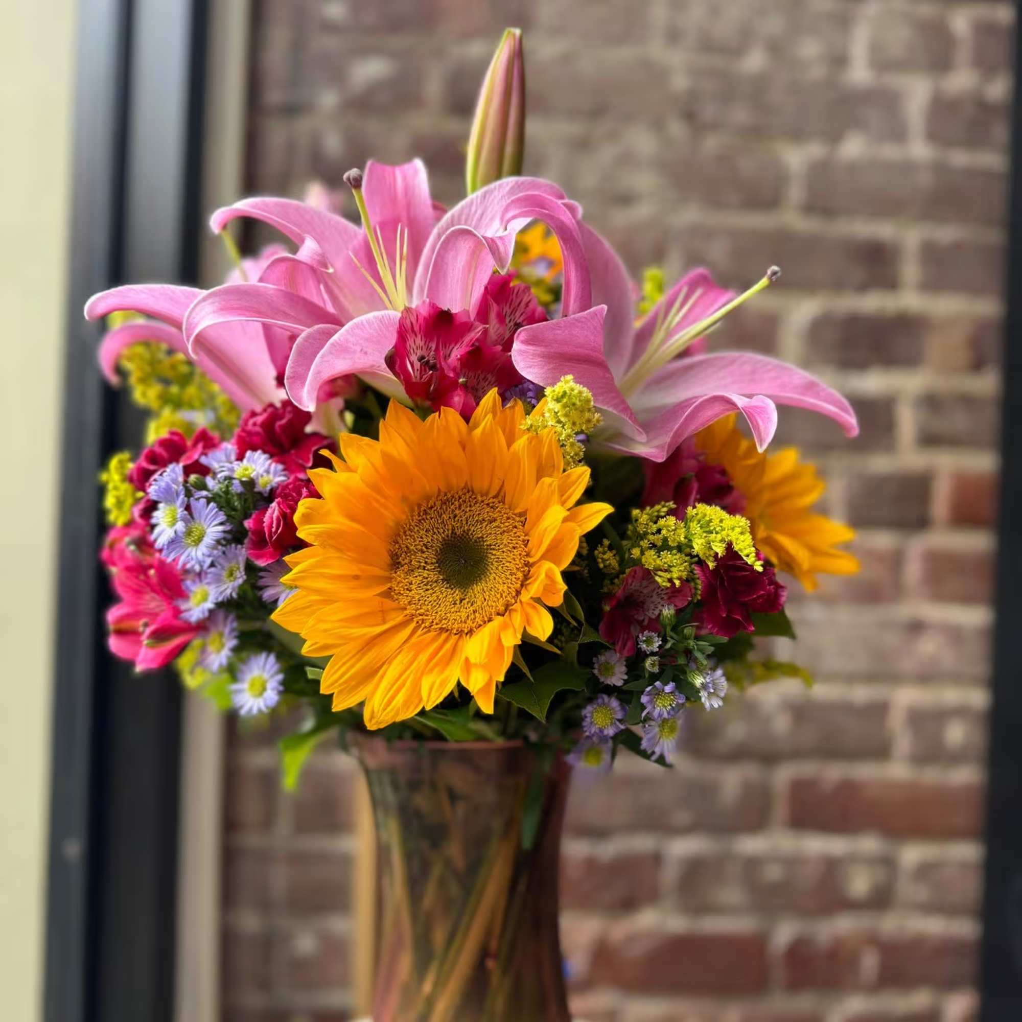 Sunflowers arrangement, it has 8 sunflowers with some greenery. Beautiful Sunflower arrangement
