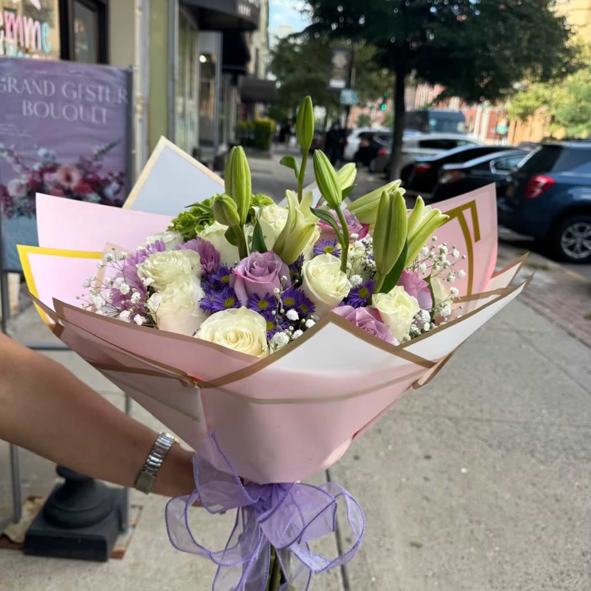 &quot;Lavender Dreams&quot; is an elegant floral arrangement that combines the purity of