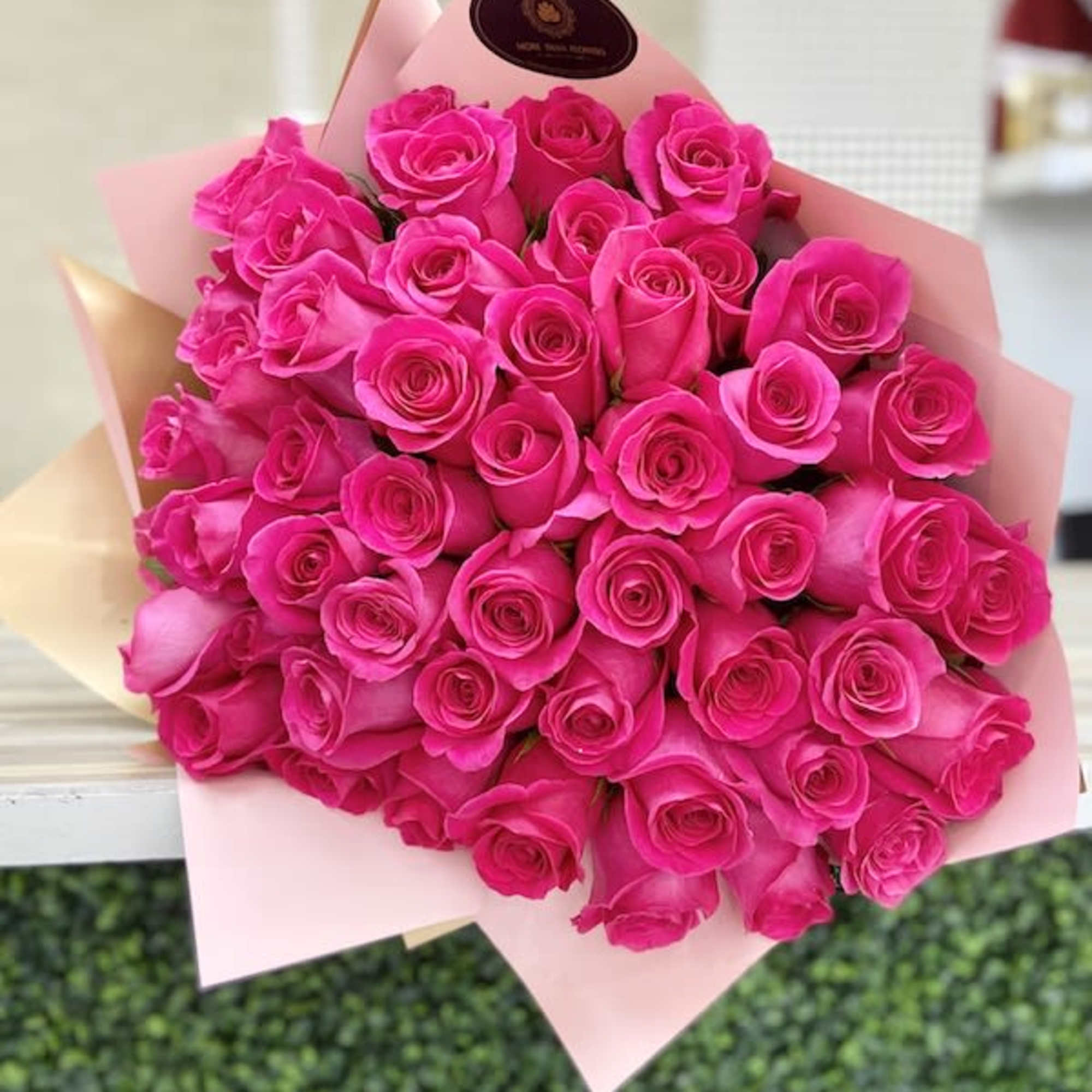 50 Roses Handheld Round Bouquet: Artistically wrapped in our special Euro Floral