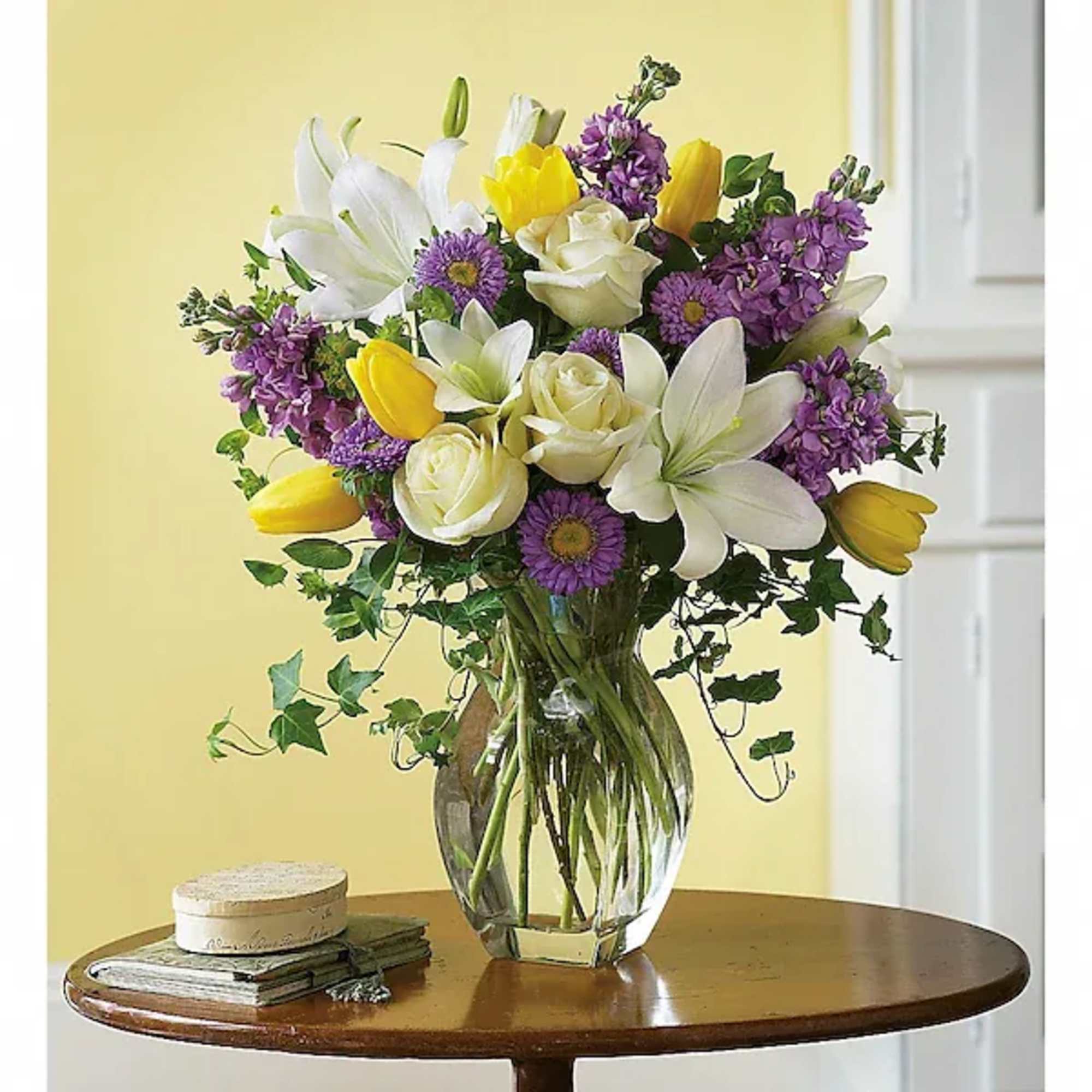 Graceful, elegant and timeless, this beautiful spring bouquet offers up colors, blossoms
