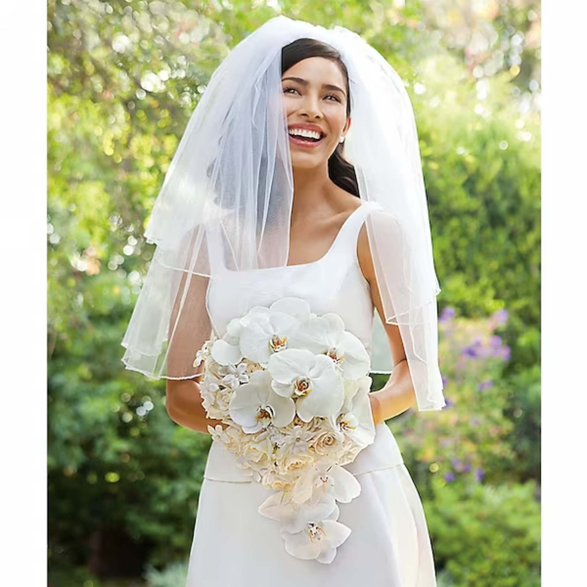 This lovely bouquet is the epitome of elegance, featuring graceful orchids, fragrant