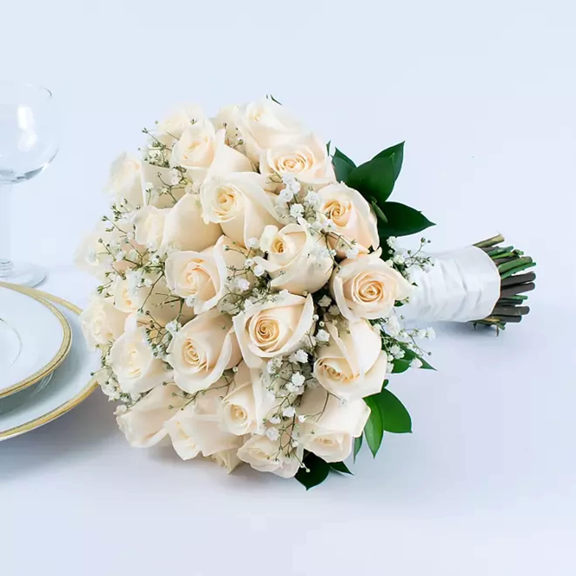 Highlighted with classic white roses &amp; complemented with baby&#039;s breath, this wedding