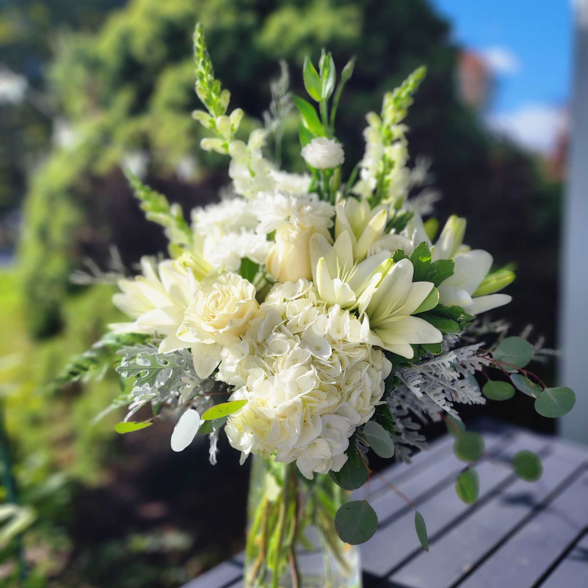 Designed with snapdragons, hydrangea, roses, cushions, lisianthus and a variety of greenery.