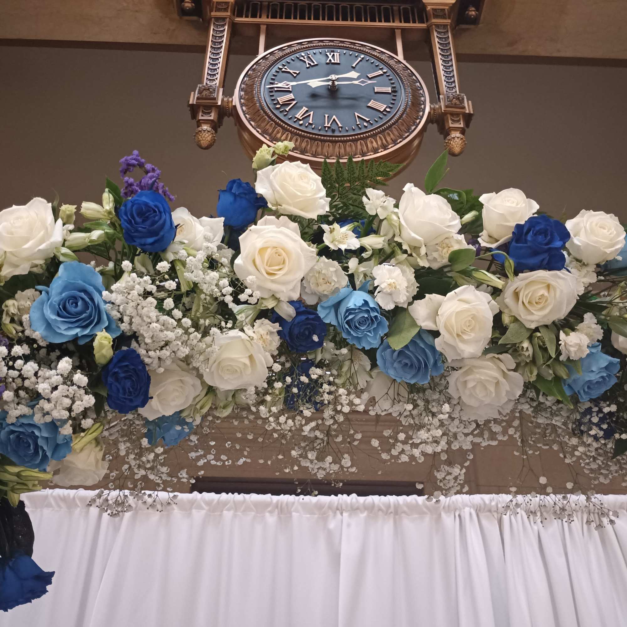 Beautiful mix of unusual light and dark blue roses, white roses, alstroemeria