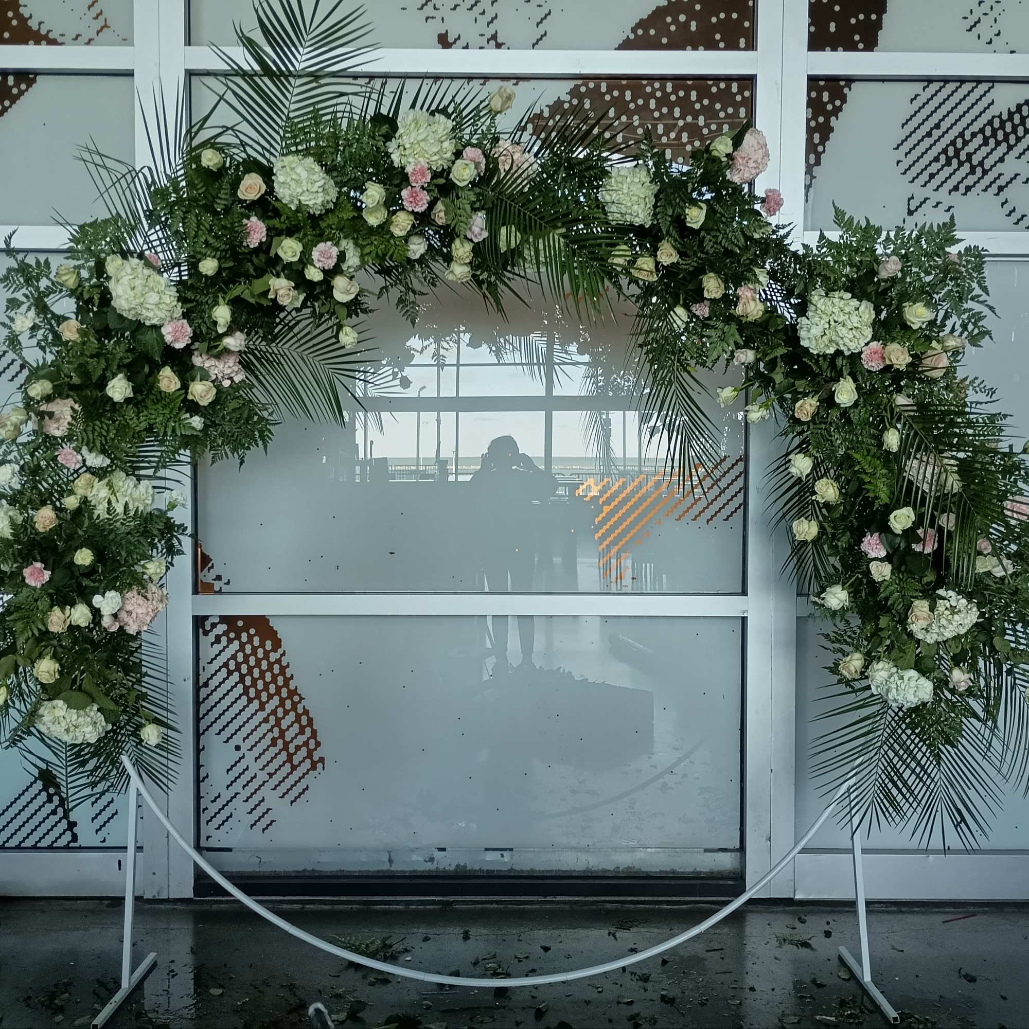 Beautiful half circle arch with white ad pink roses, carnations, hydrangea ad