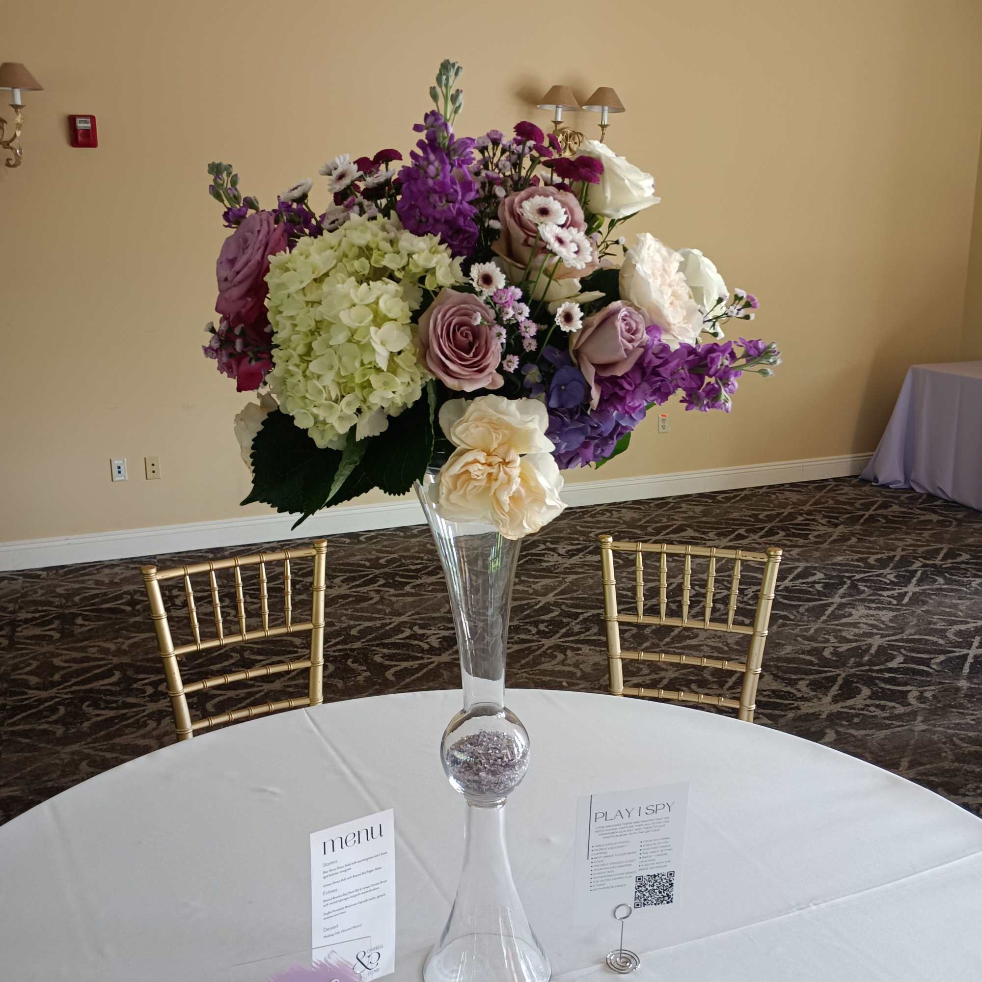 Beautiful shades of Lavander, purple, burgundy and white roses, hydrangeas, daisies and