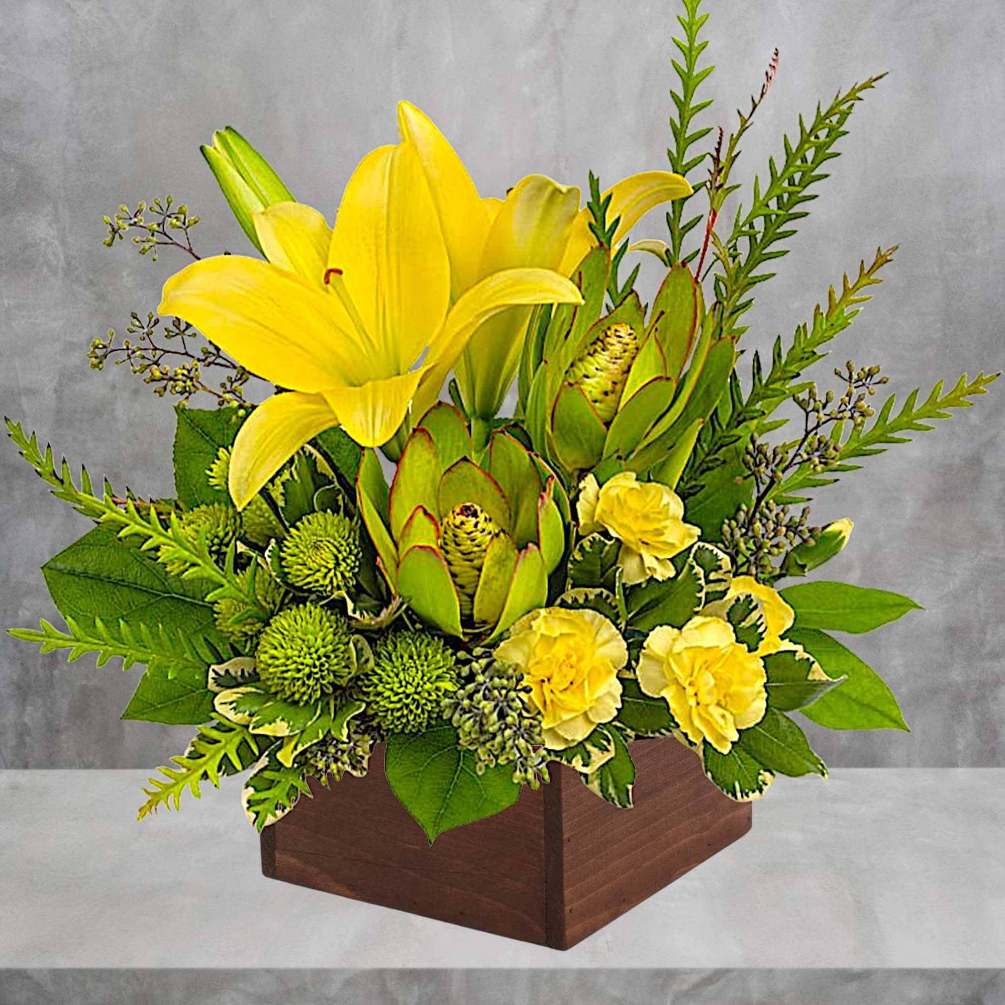 Let the sunshine in! This artistic arrangement of radiant lilies and fresh