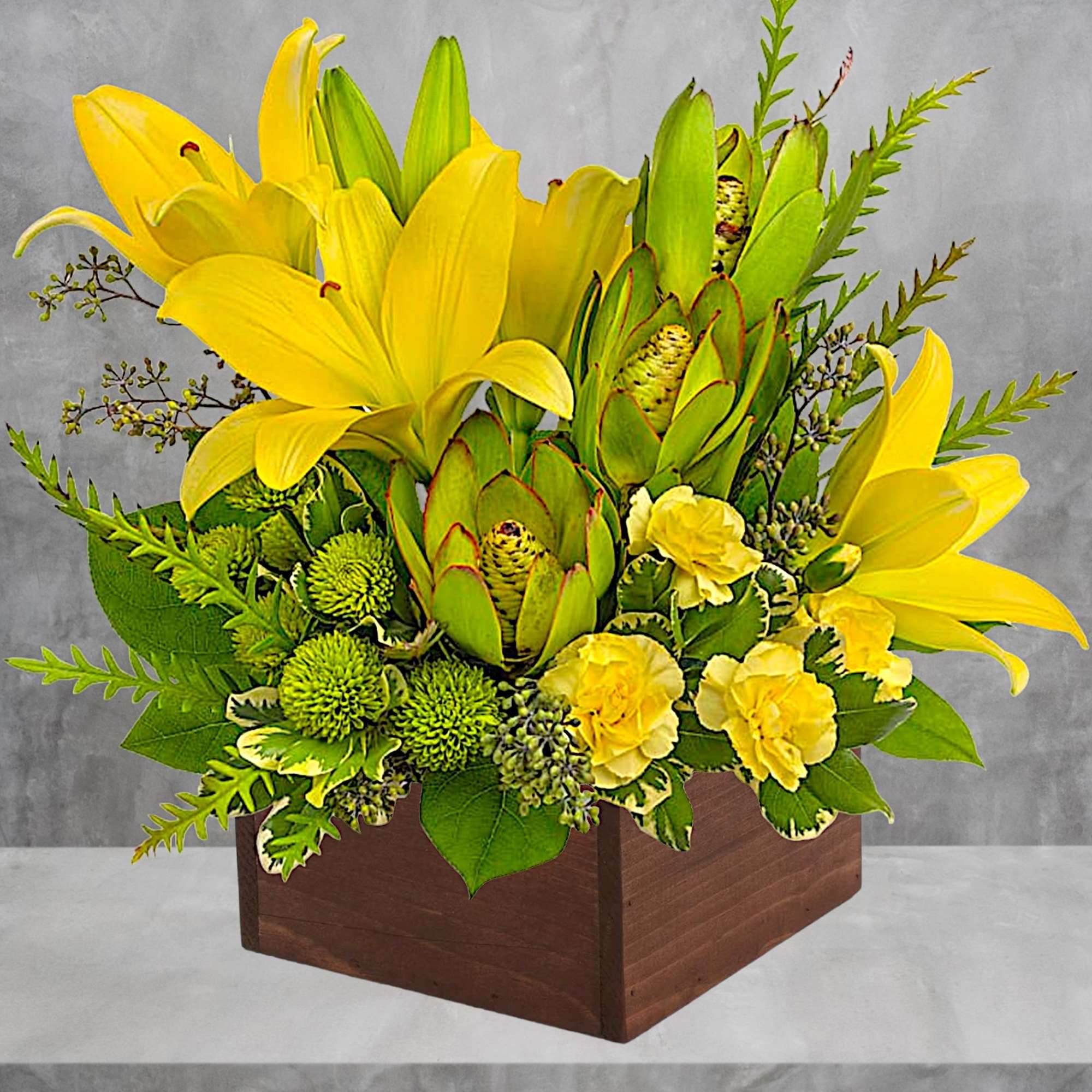 Let the sunshine in! This artistic arrangement of radiant lilies and fresh
