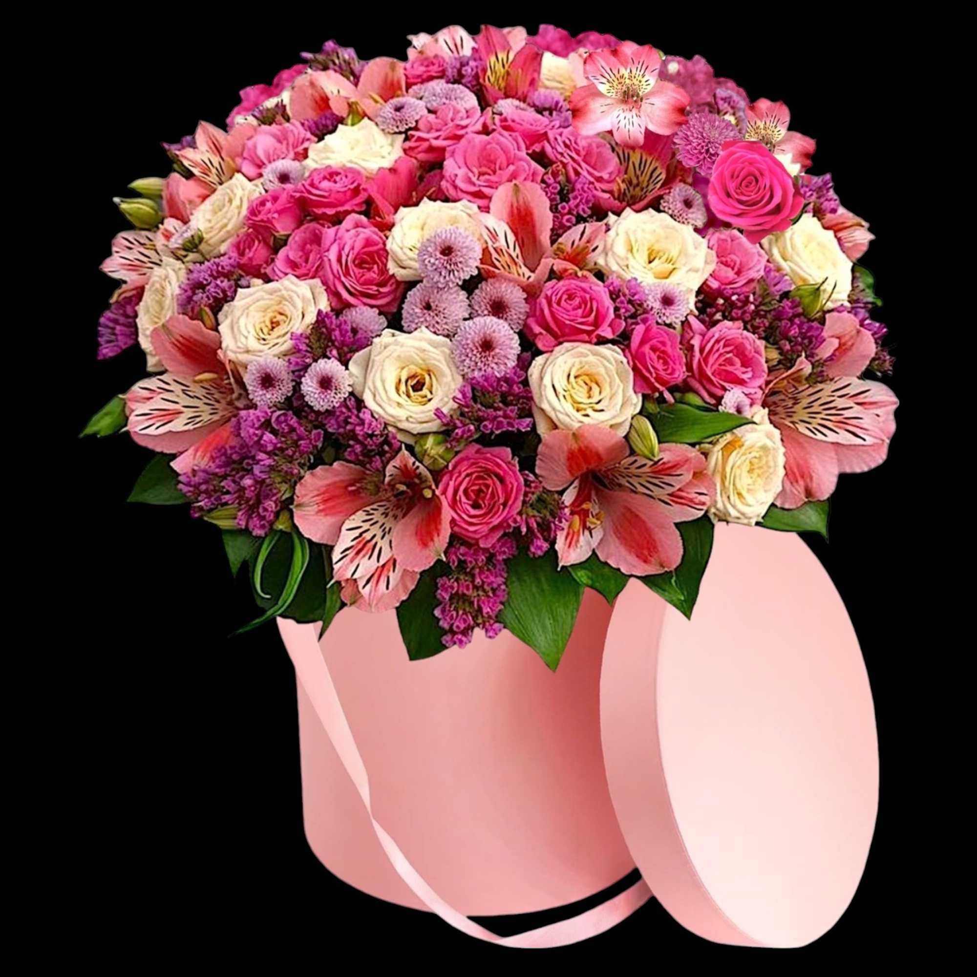 A modern petite flower arrangement in a cylinder box filled with a