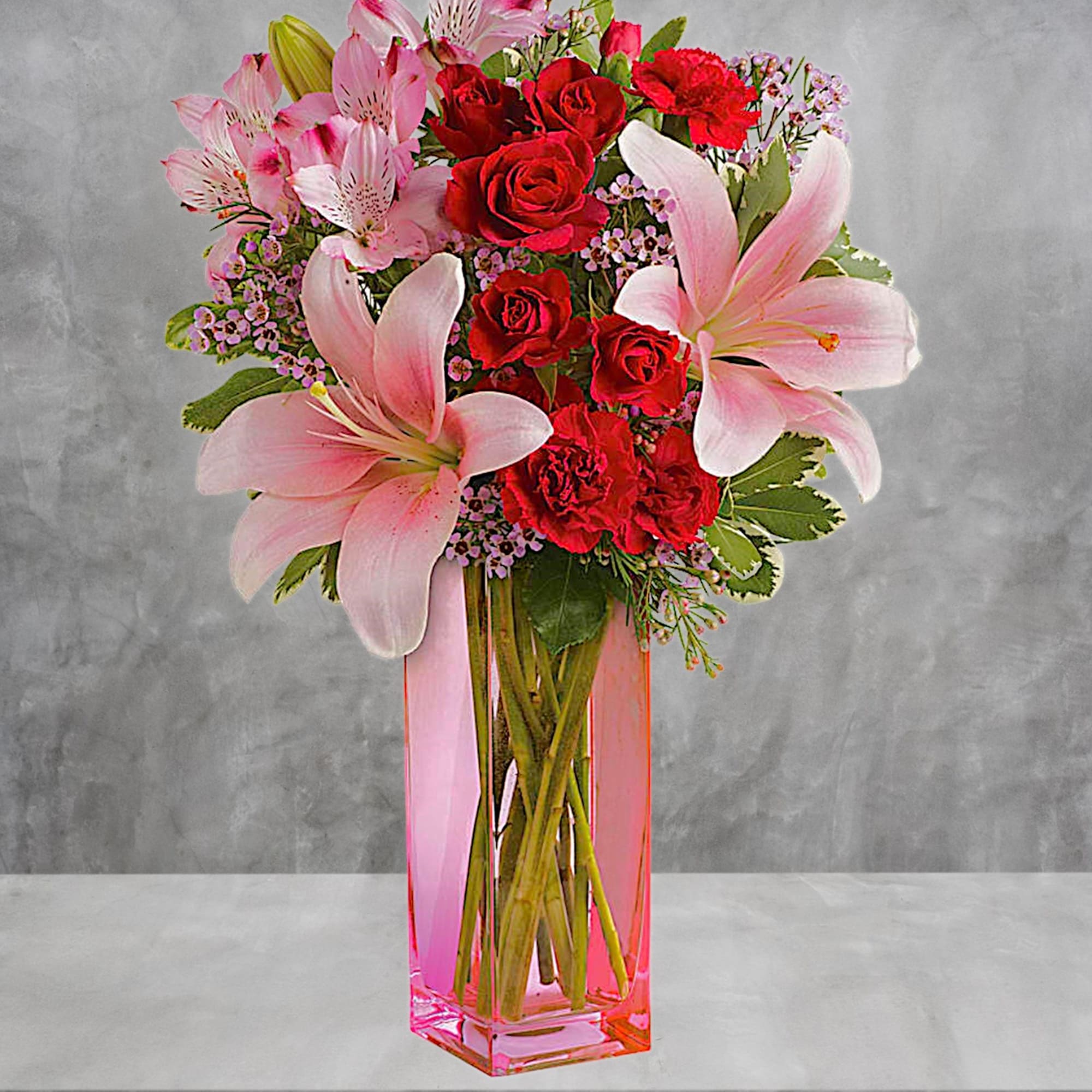 Make it a special day! This passionate bouquet of lovely lilies and