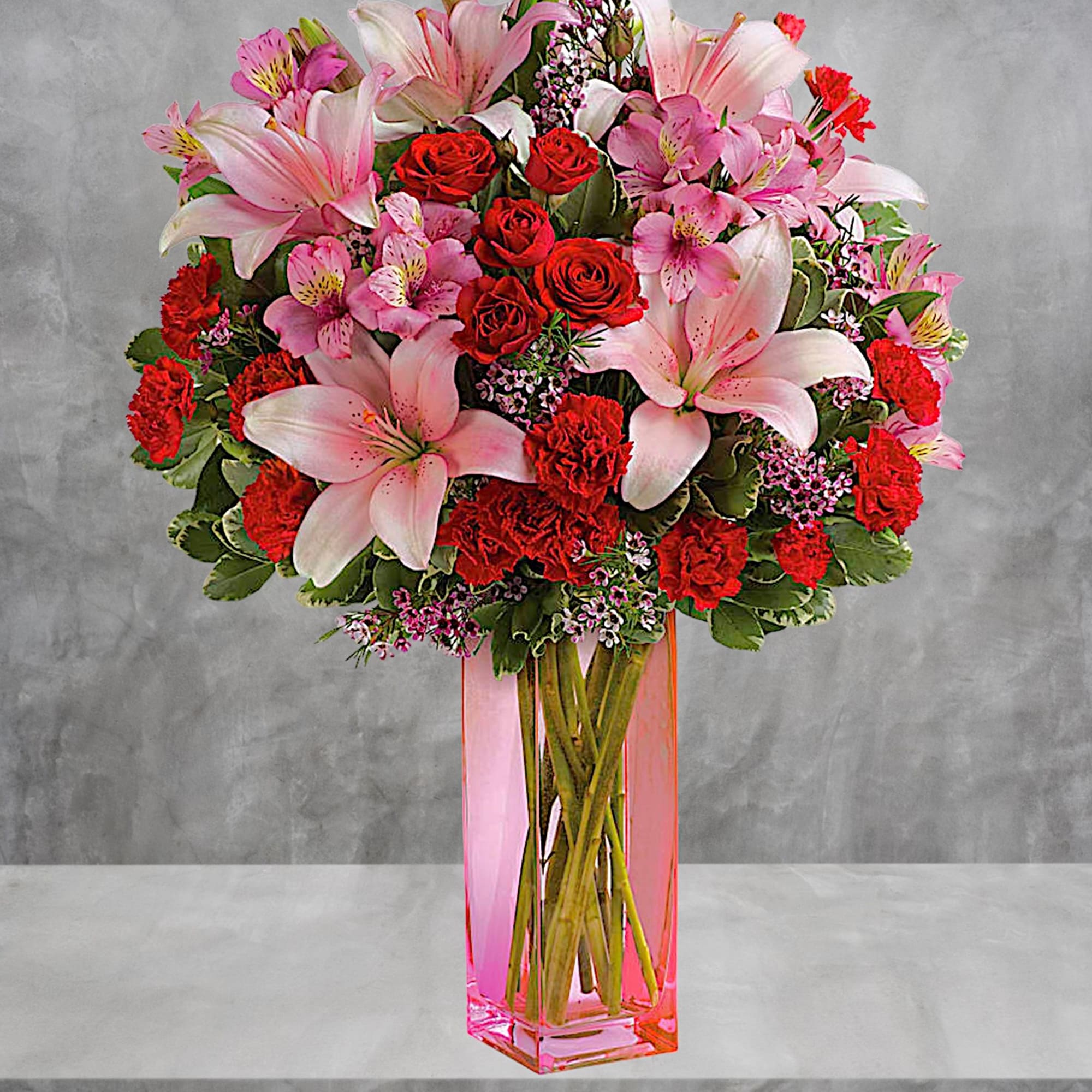 Make it a special day! This passionate bouquet of lovely lilies and