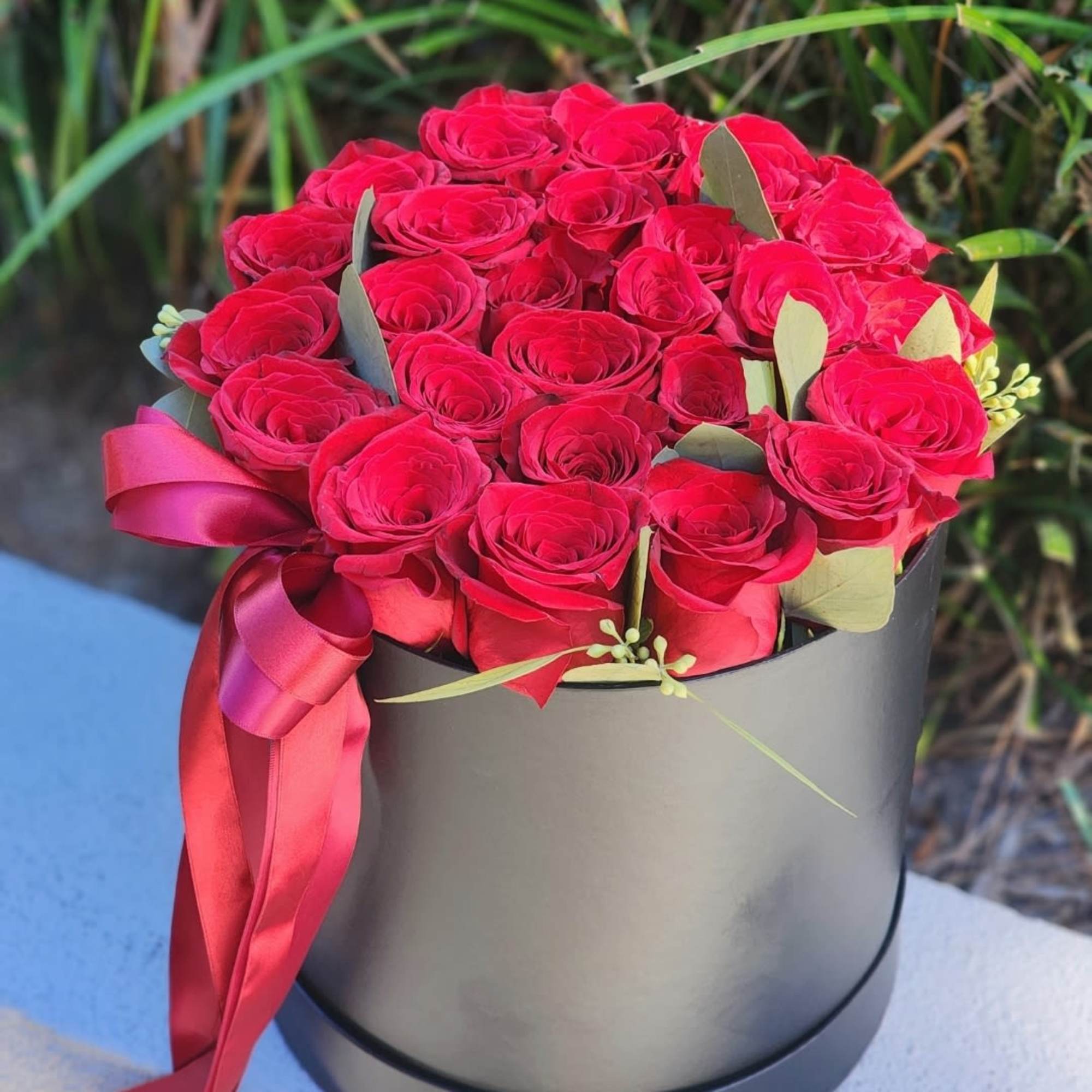 Delight in the beauty of our white hatbox packed with lush red