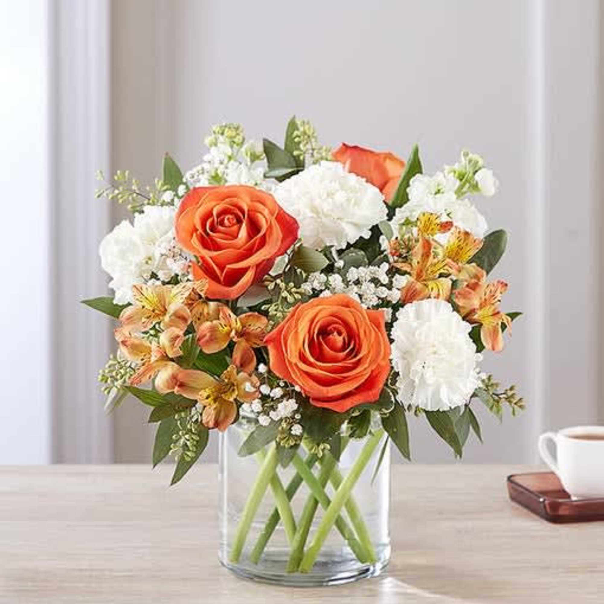 The sweet citrus shades in our charming new bouquet bring your sentiments