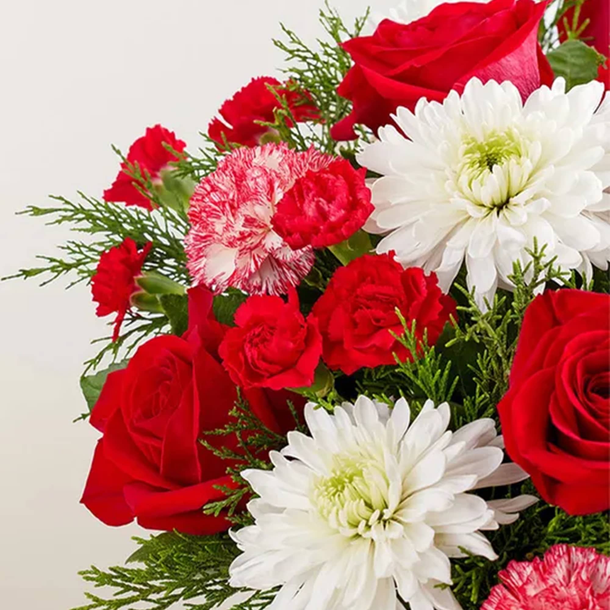 Give the gift of joy with our festive mix of blooms. This
