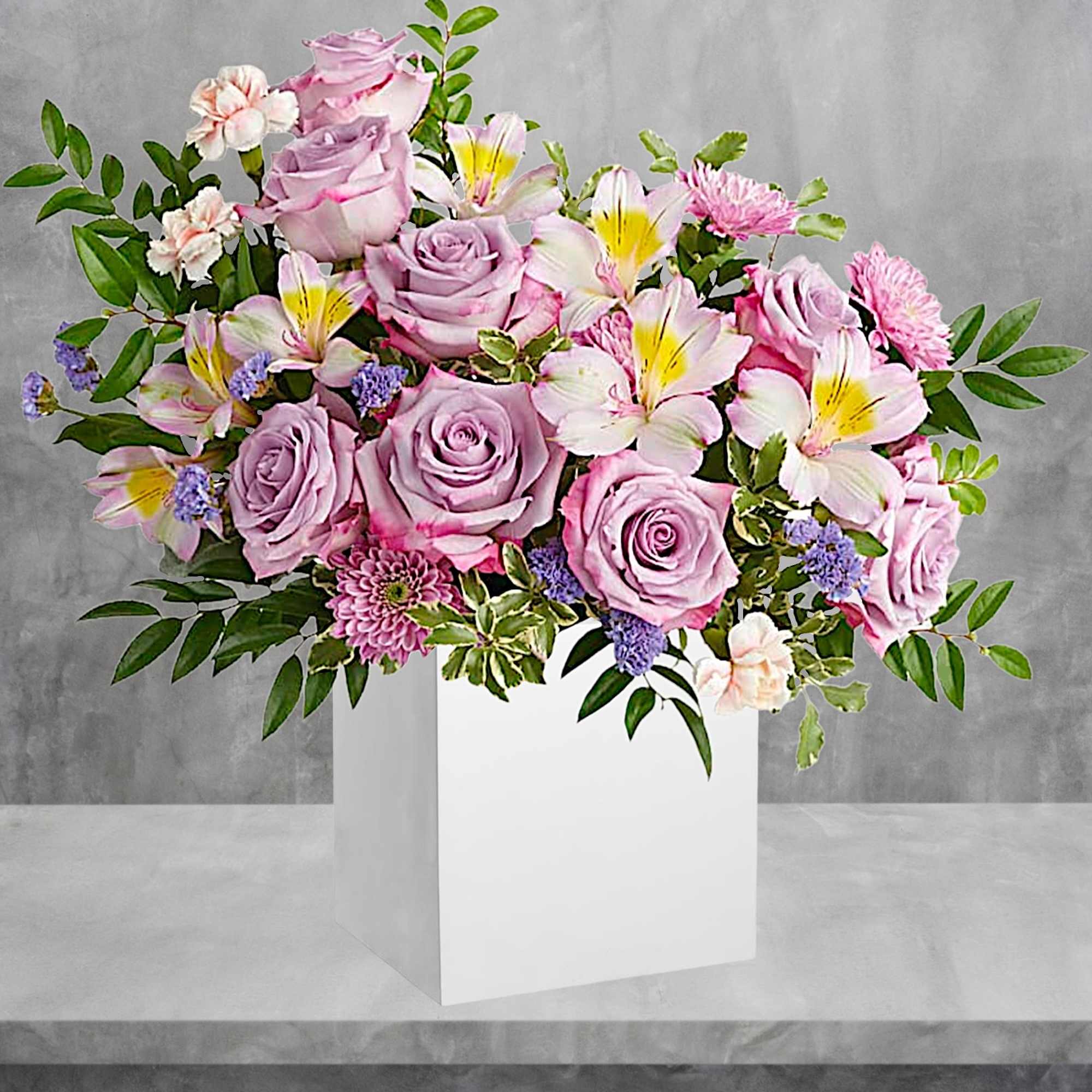 Make spring shimmer with this luxurious lavender arrangement, hand-delivered in a wooden