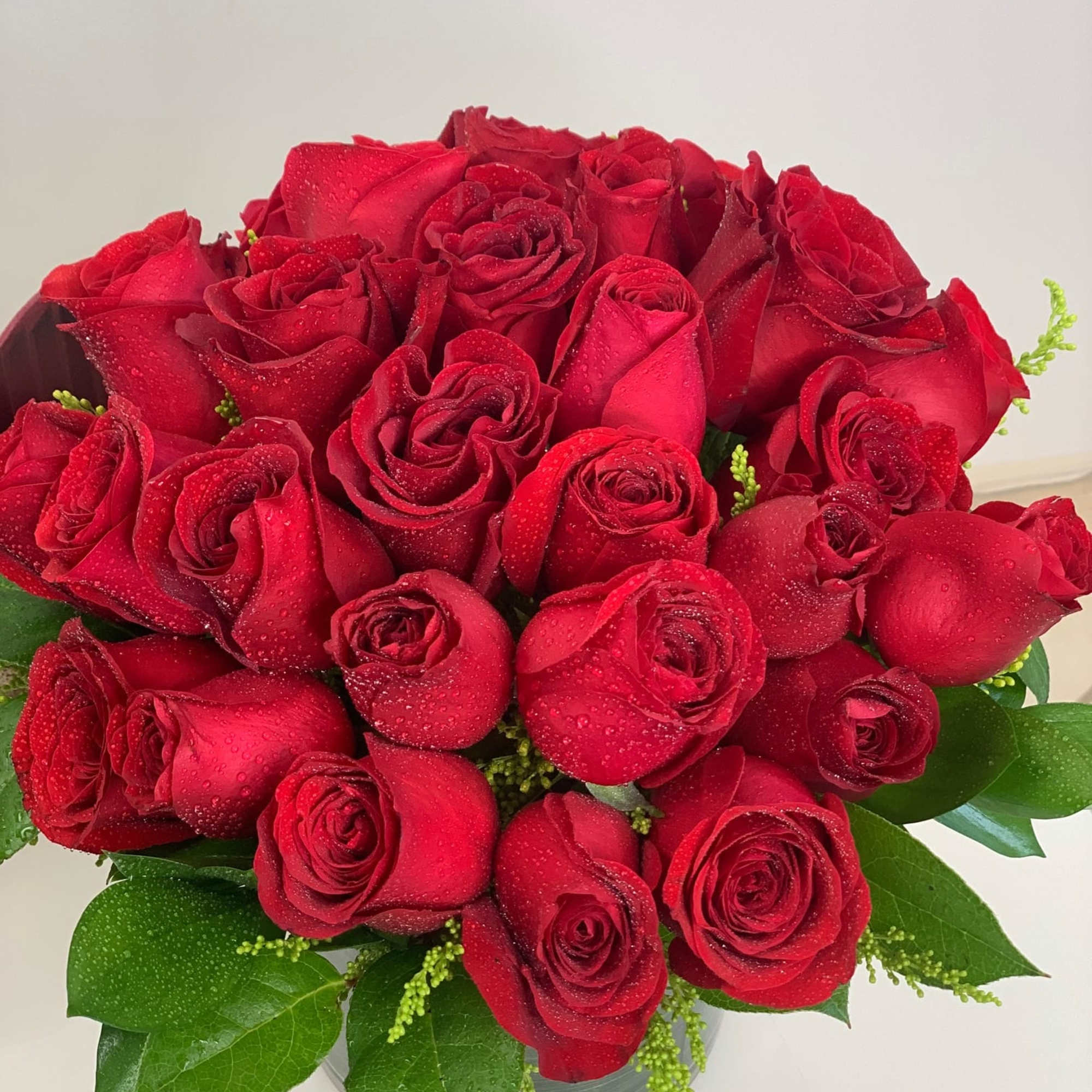 This arrangement is full of quality red roses and very classy looking.