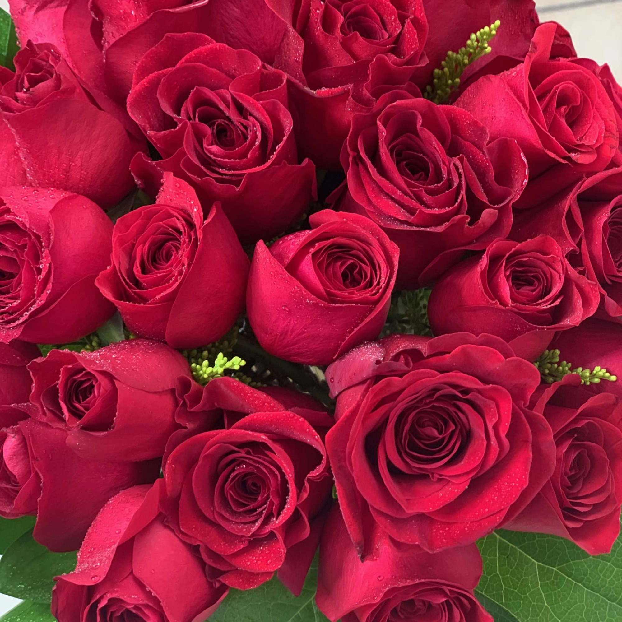 This arrangement is full of quality red roses and very classy looking.