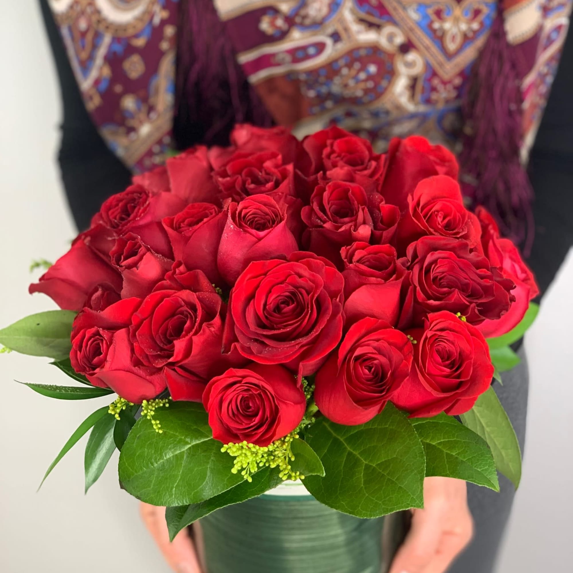 This arrangement is full of quality red roses and very classy looking.