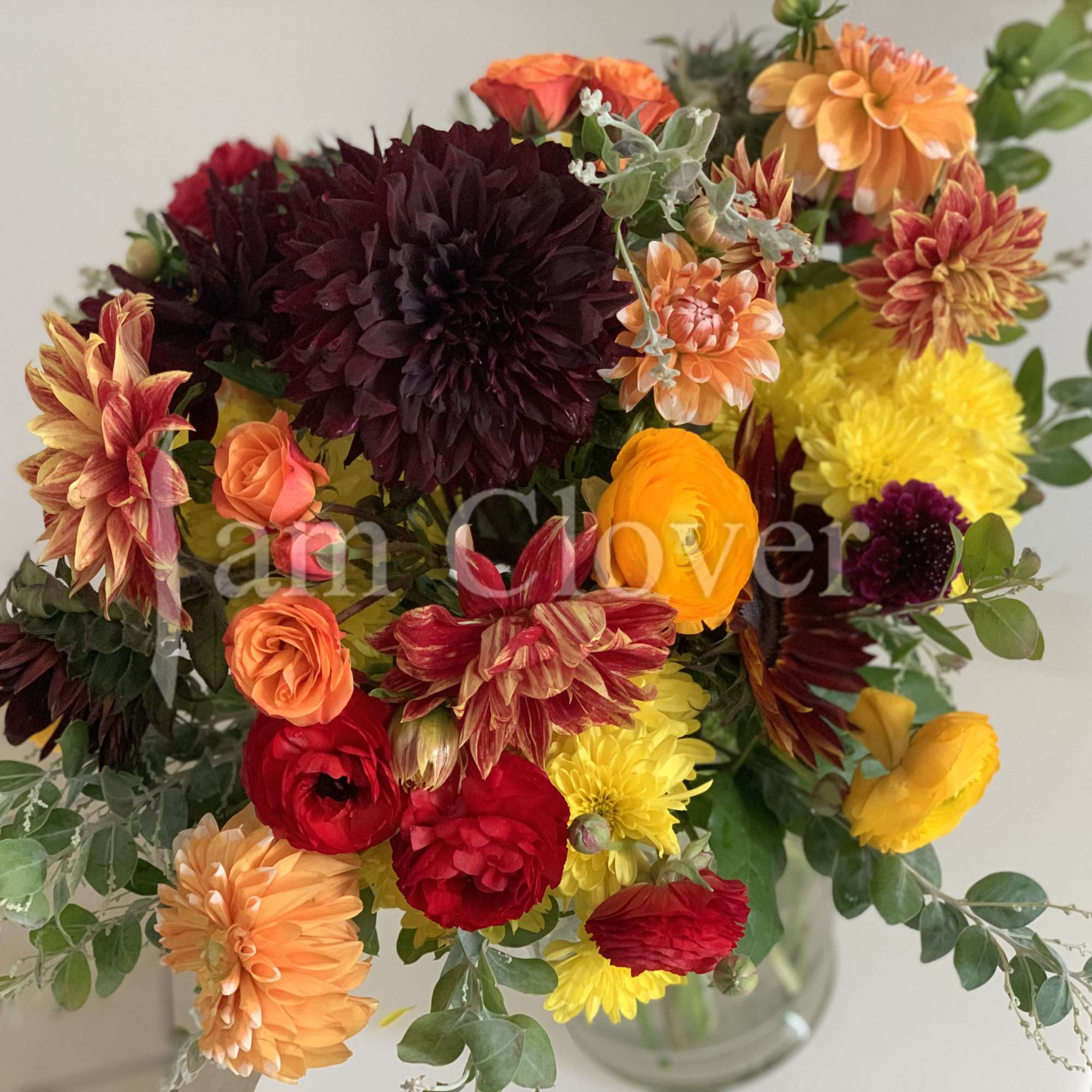 This autumn bouquet captures the warm, rich hues of the season, blending