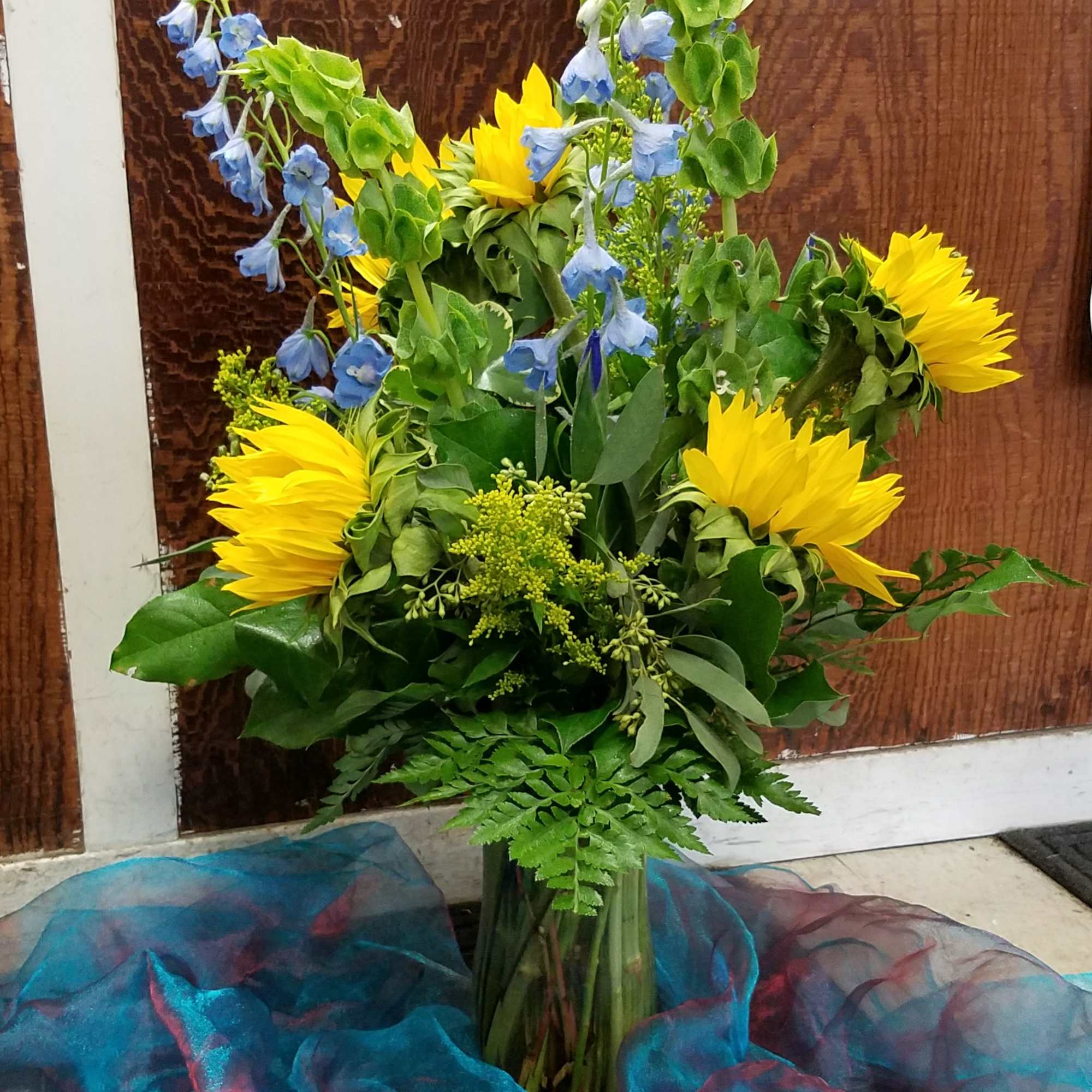 This cheery arrangement is a great way to brighten up any space.