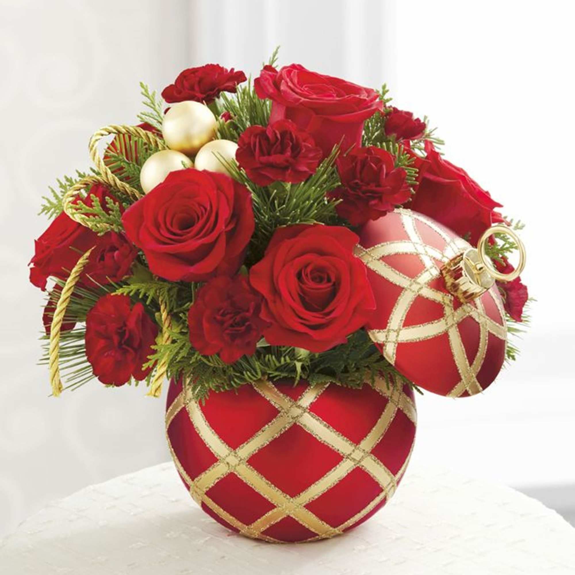 The Season&#039;s Greetings Arrangement is an expression of holiday elegance set to