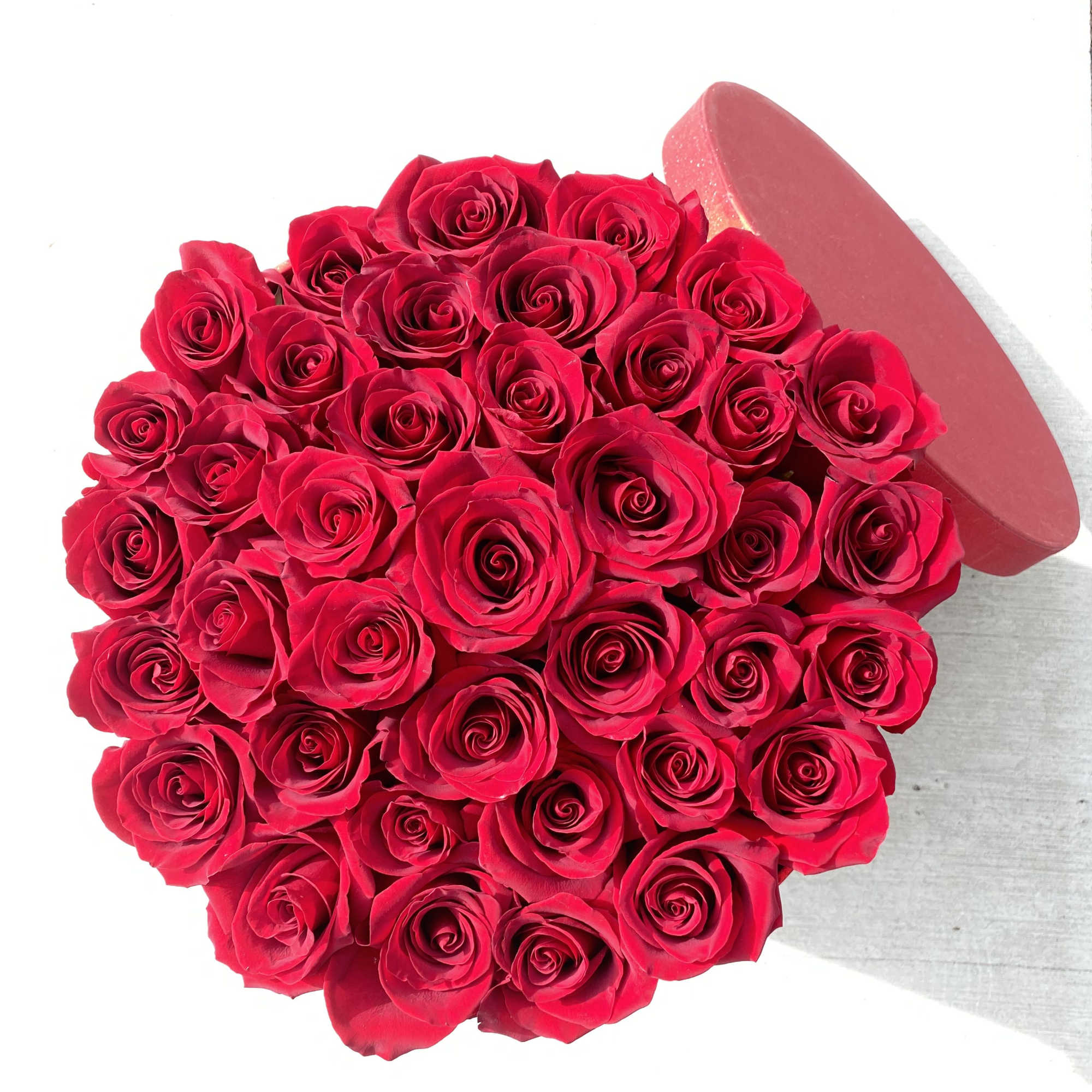 Gift the ultimate gift of love with these dozen fresh red roses