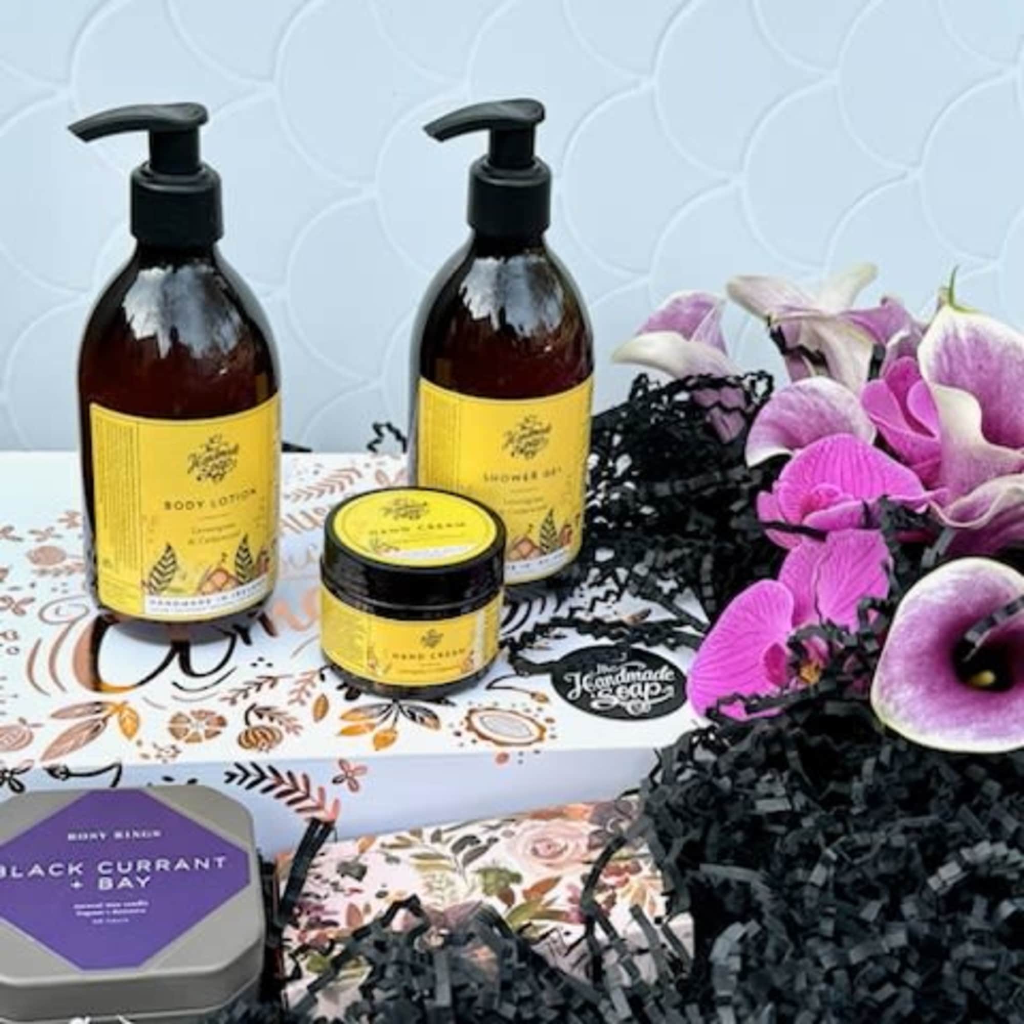 A beautiful display in a wooden crate filled with purple florals, and A beautiful display in a wooden crate filled with purple florals, and