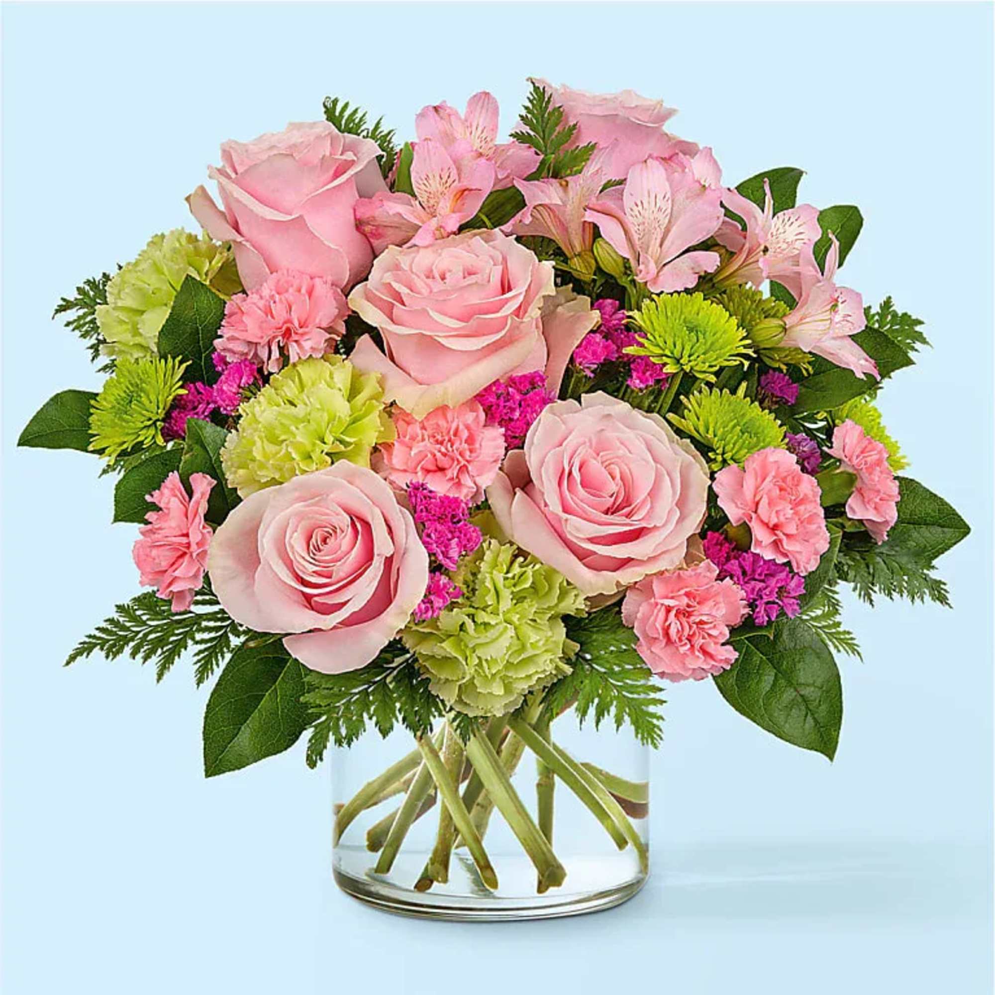 Overflowing with blushing pink and refreshing green blooms, the Pinch Me Bouquet